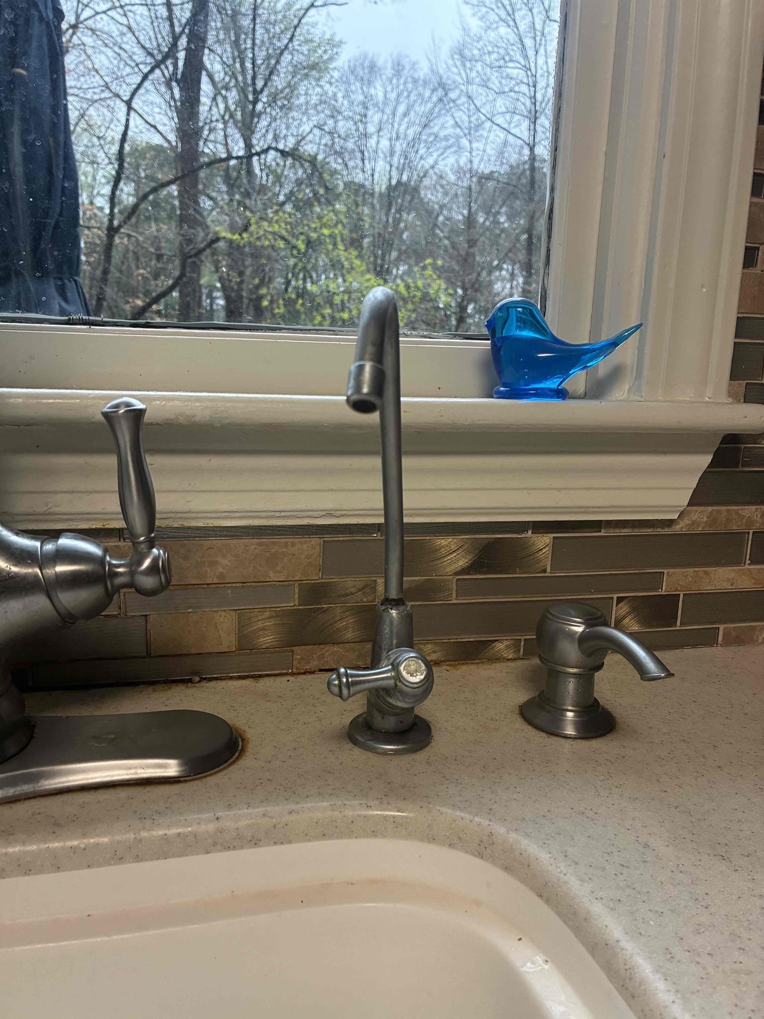 Take apart tubular pipe and fittings from below kitchen sink and install new basket strainer. Reconnect drain and test for proper operation and leaks. No leaks found after work completed.