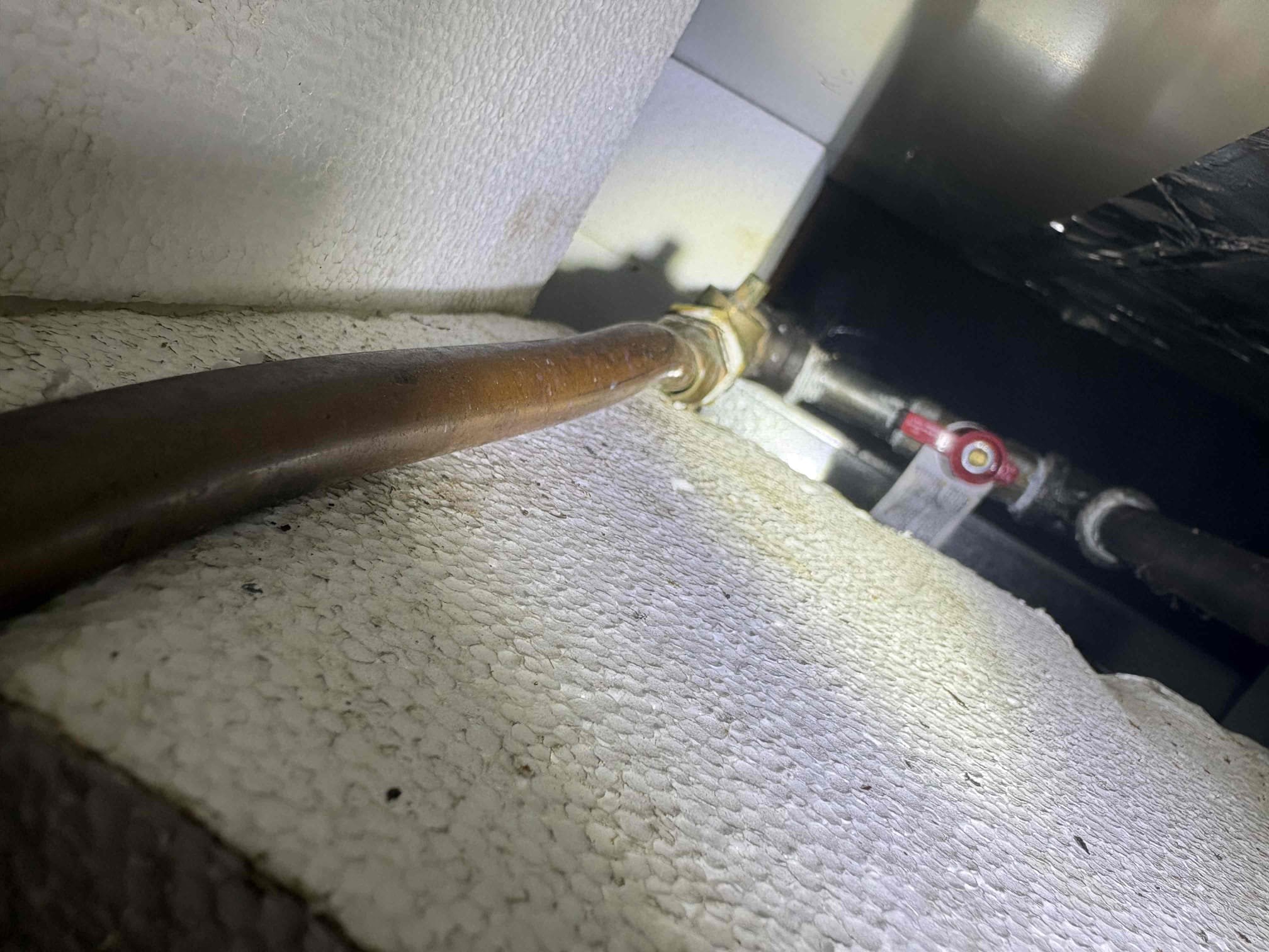 Client called us out due to the gas company turning off their gas due to them finding a couple leaks on the system. The culprit of the leak was an old 3/8” type L soft copper gas line that was dented under the furnace, and heavily corroded all along the run of it. 

We replaced the copper gas line with new CSST gas piping, tied in up in attic just beside furnace with a shutoff, and also a shutoff at the water heater per code. New gas fittings for water heater sediment trap also. To complete the necessary work we had to uninstall the water heater due to the gas lines running behind it. After work was done reinstalled the existing water heater then got air out and fired it up. Also, the gas tie in for kitchen stove was at the water heater but there was no need for them to run it how they did. We moved that tie in up in attic next to furnace as well with a gas shutoff. 

Tested all connections, all good. 

1 yr warranty (Does not cover any issue with the 6 yr old tank that may arise in fu