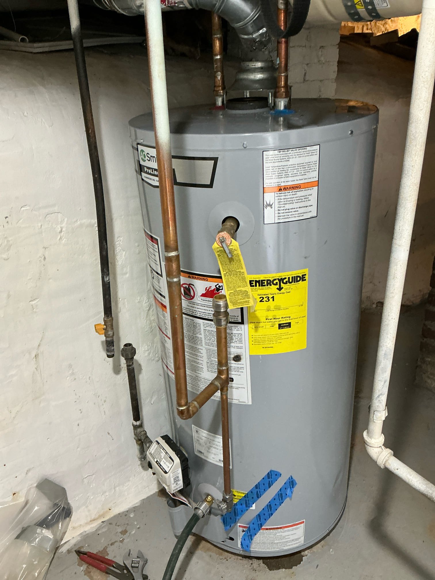 Removed 40 gallon natural gas water heater in basement. Capped off water and gas.