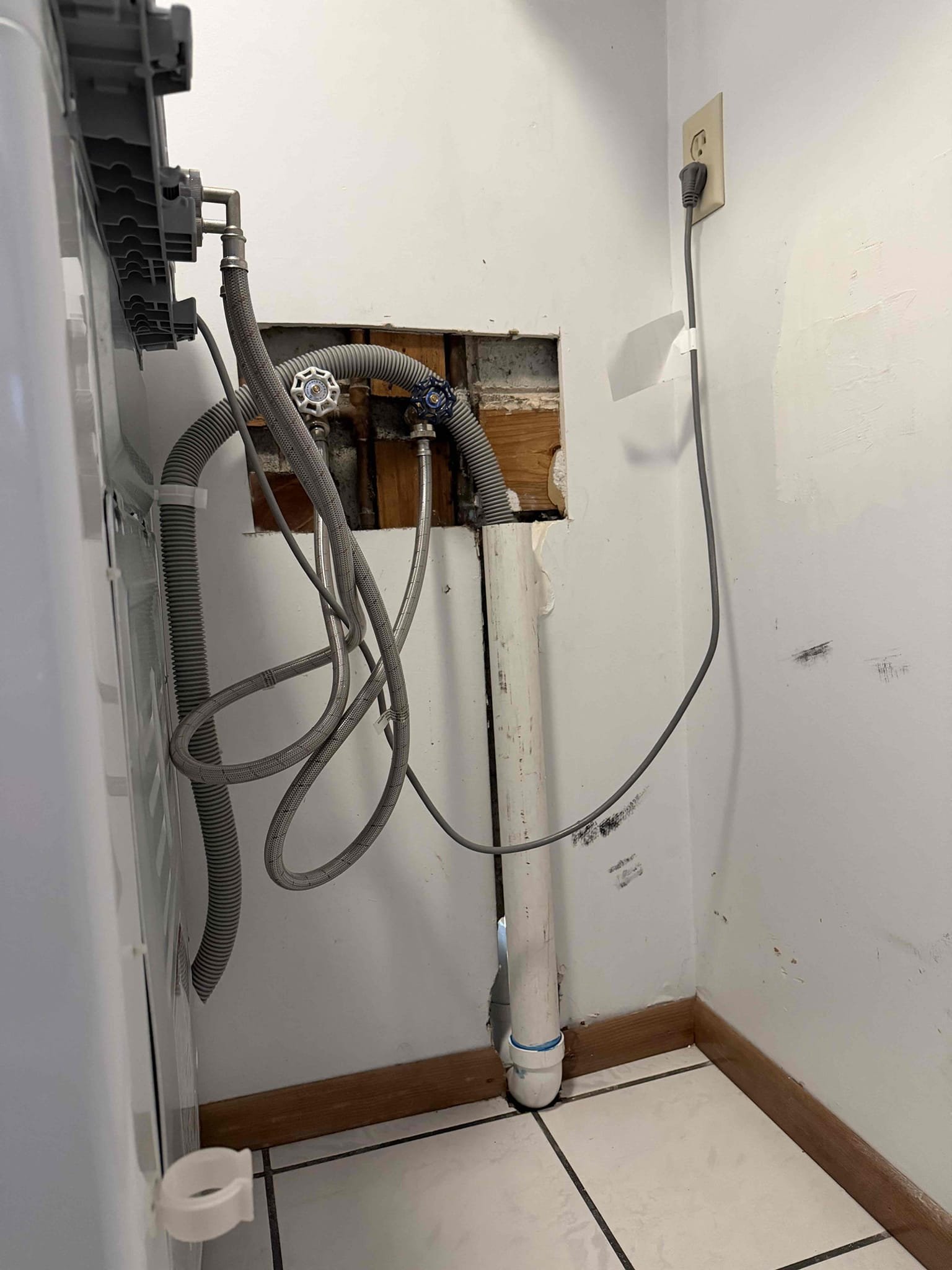 Cut Sheetrock to access plumbing. Once plumbing is exposed give quote to install new drain line and wash machine box.
Replace water shut off valves for laundry box and also install new pvc piping for laundry drain.

Installed quoted work. Tested all work and no leaks were present at this time. Also ran snake through laundry drain. Tested draining now. Laundry is draining as it should.  Cleaned up work area.