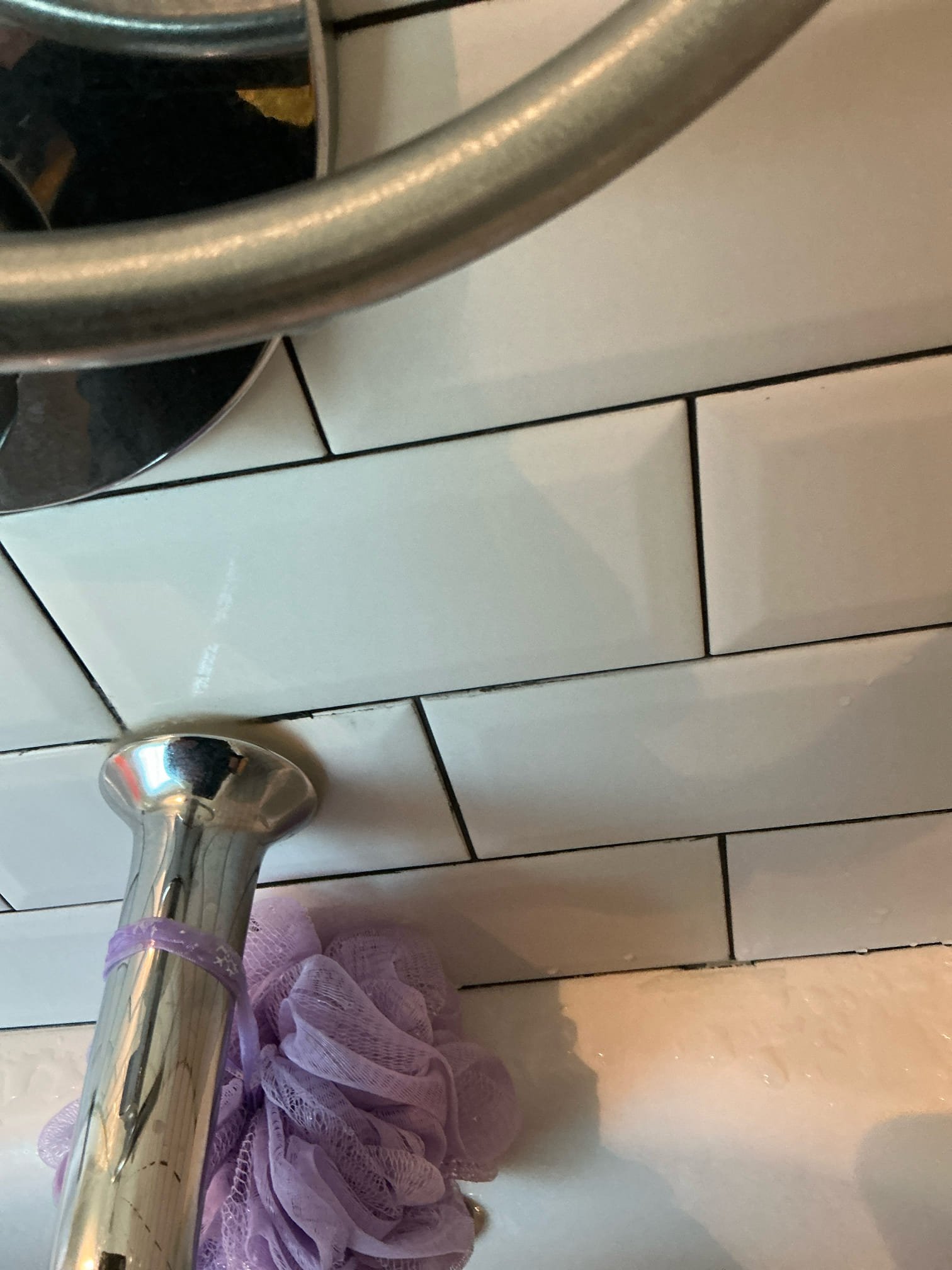 Found wet spot in ceiling below upstairs restroom tub. Cut sheet rock to expose drain. Ran tub and shower to check for leaks. Could not replicate leak. Caulked openings around tub&shower trim.