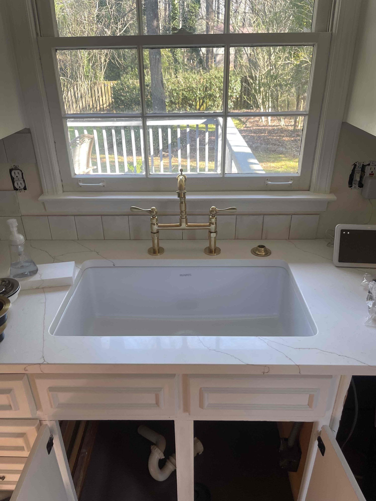 Replaced three stop valves under kitchen sink. Connected sink drain to wall outlet, installed customer supplied strainer, added dishwasher branch to the tubular piping and capped off the old copper drain in the crawlspace as Home Depot installers will not go into the crawlspace. Finished connecting kitchen faucet. Tested to ensure a leak free install. 