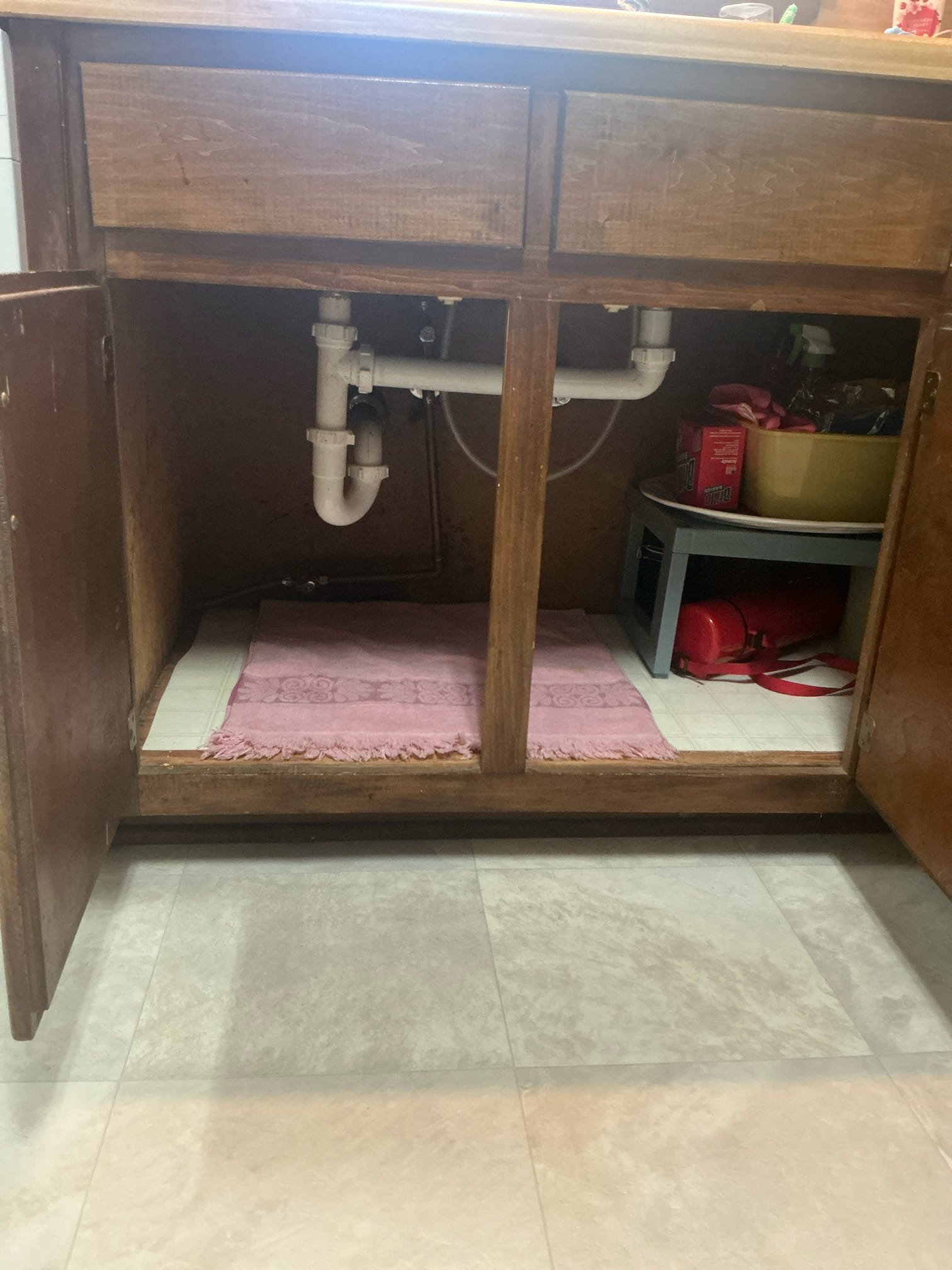 Found kitchen sink clogged with grease. Jetted drain from tap tee in crawl space to remove grease. Snaked upstairs master restroom lavatory and pulled back hair. Ran water for several minutes to test no other issues at this time.