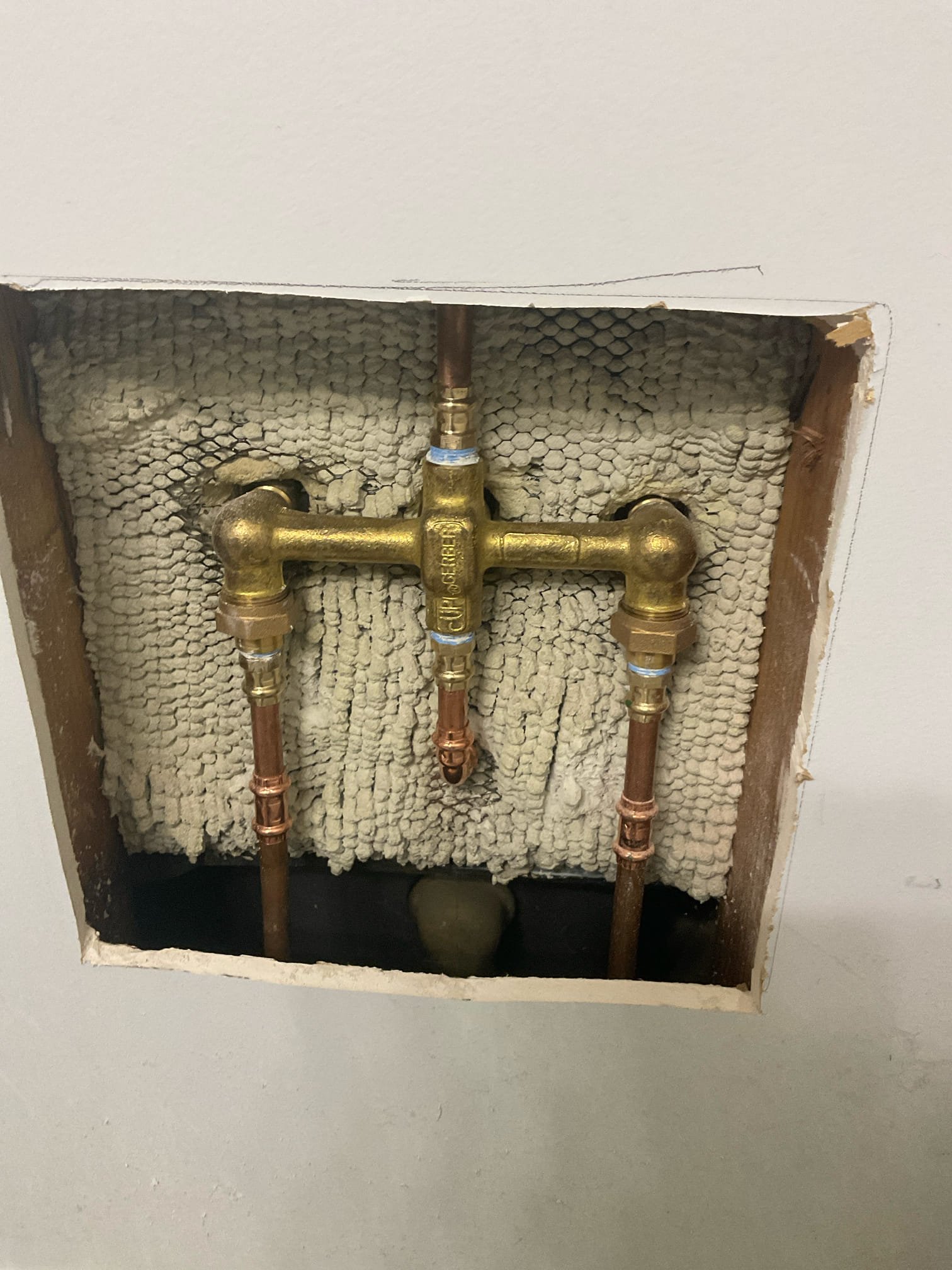 Today we cut drywall behind an upstairs bathroom three handle tub and shower valve , we replaced an old three handle shower valve with a Gerber chrome three handle set , we installed an access panel behind the faucet . 
Tested no any leaks . 