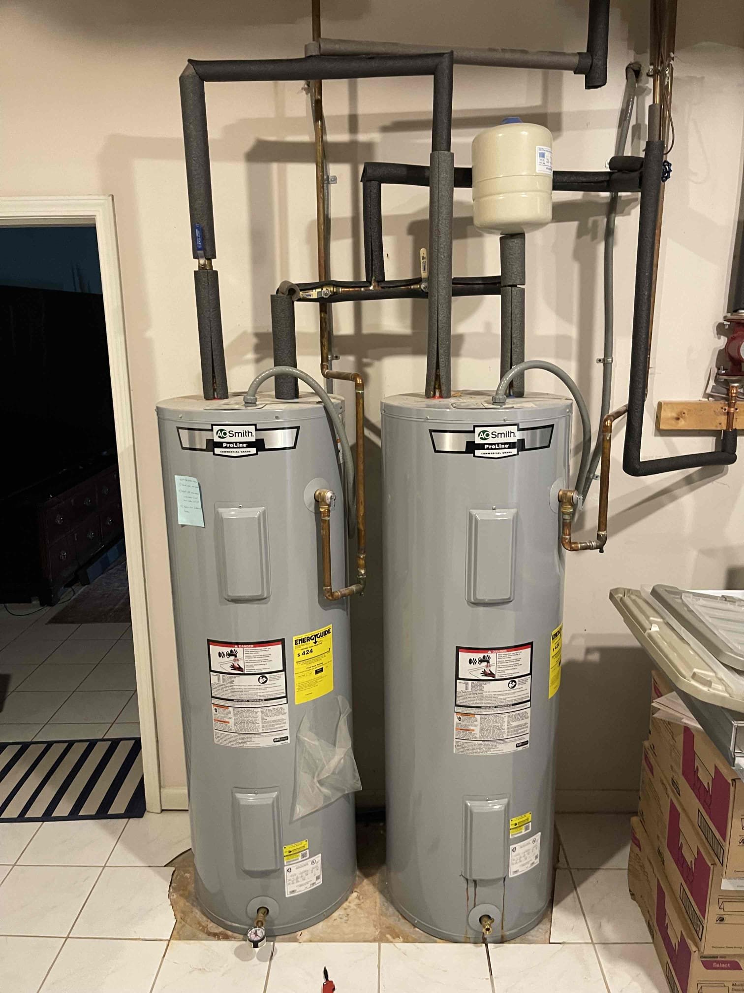 Left multiple quote options for the water heaters. One tank is leaking and tripping the breaker. We closed the valves to the tank.