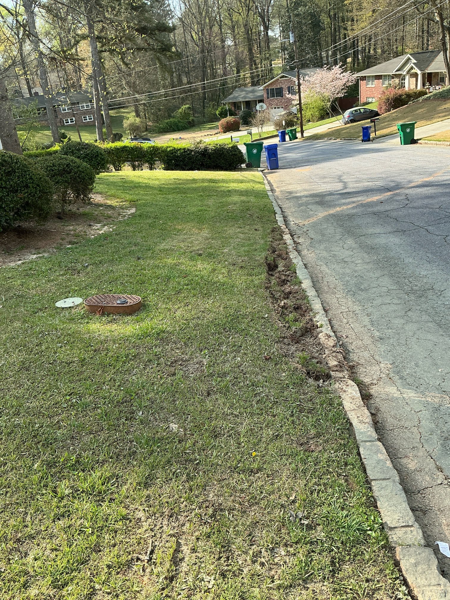 Came out due to me running a tire through our customers neighbors yard just past the curb. The day we did the job there was water constantly running in that area and down the street. Trying to get out of the way i backed up and unintentionally went in these folks yard. I inspected the water meter and they do not have a leak on their side at least. The area is still damp but there is not water flowing out now. Unsure where the water was coming from, but it had made that area of the yard super saturated which would be the reason the tire  made that slight rut in the yard by the curb. Will talk with hunter to see what we can do about the yard tomorrow as he is in a meeting today. 