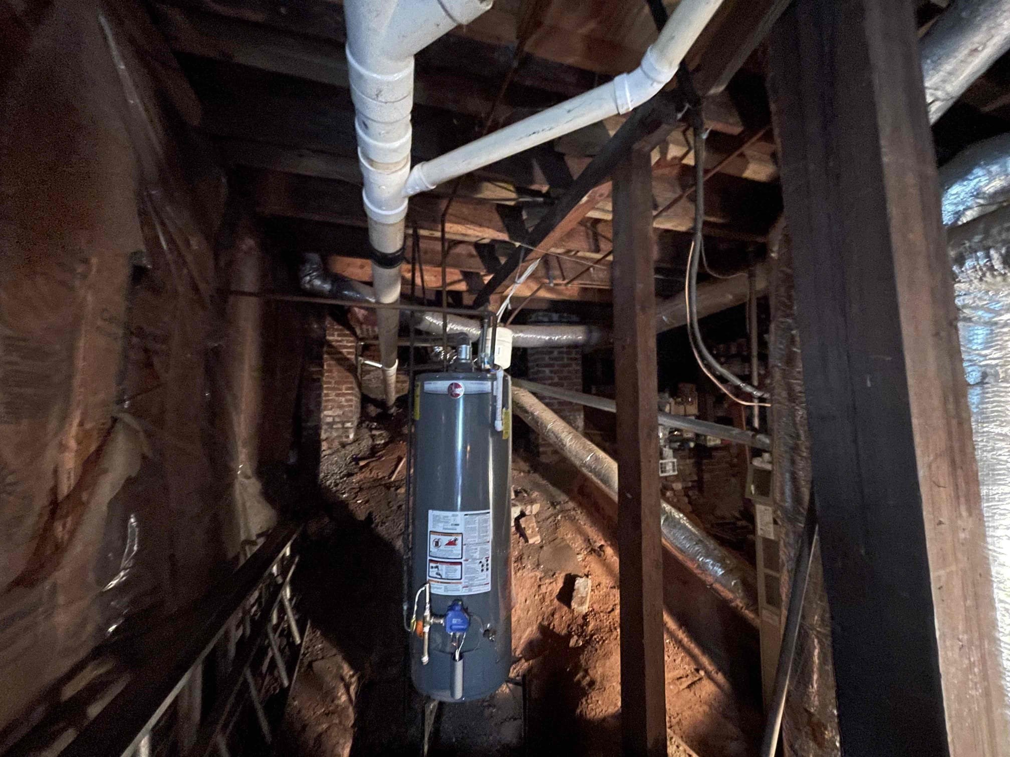 Water heater was able to be lit. Did not notice anything actively leaking. Vent was drafting correctly. Vent is ran into a chimney chase which is against code without having a liner installed by a licensed hvac company. Left quote to replace the water heater as it is 12 years old. Customer is considering doing a tankless water heater instead and wants to do some more research before she decides since the water heater is still working. 