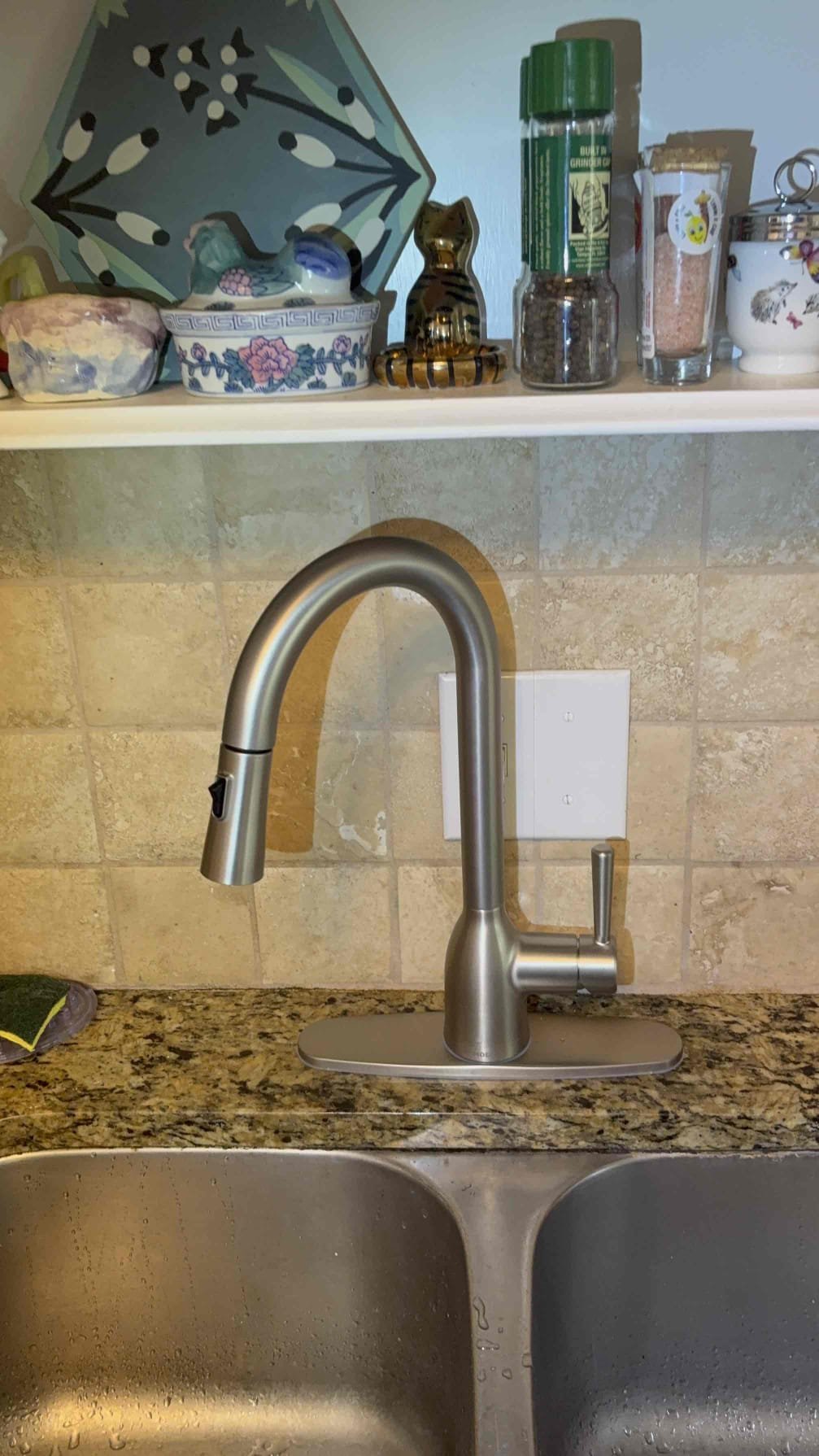 Client called us out due to a leak beneath the kitchen sink that soaked the cabinet and leaked down below into the basement. Discovered it was the side sprayer nozzle leaking at the hose connection when water was on to the faucet. We replaced that faulty kitchen faucet with new moen customer supplied faucet that we picked up from Home Depot and installed. Tested all connections, no leaks. 

1 yr labor warranty