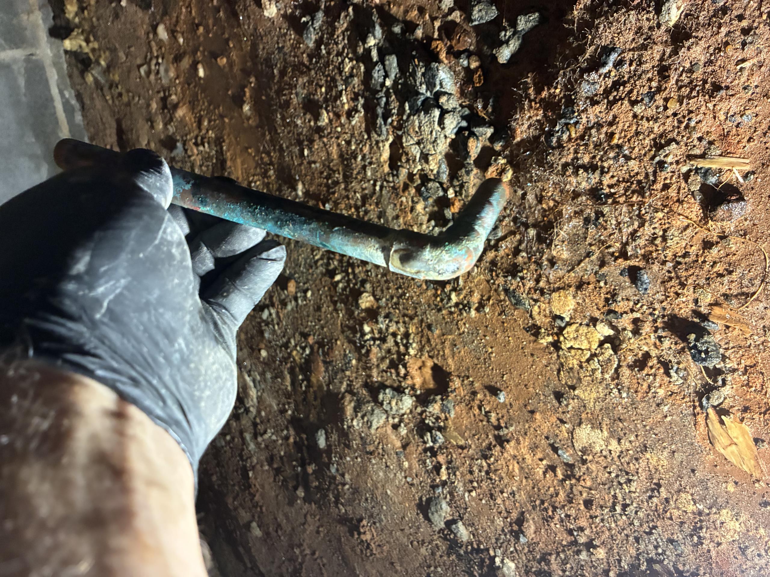 Call for sewer cable stuck in clean out, and backed up sewer main.

Arrived and met with Bud. He explained that he was trying to get the sewer line cleared and his cable bound up, and became stuck in the clean out. 

I asked about the history of the home, and Bud mentioned that the main has been replaced with pvc to replace terra cotta pipes. A few years after the replacement he started having issues again. Once I ran the hydrojet and was able to get the camera in I found that there is still 10-15 feet of old line towards the city side. Severe root intrusion has led to backups. I ran the jet at each union and cleared the roots. Video before, during, and after shows progress. 

Bud also asked me to check a leak under the home, and I repaired a half inch copper elbow with a pin hole. I also replaced another small section of copper with an active leak during this process.

I discussed options for repair and replacement of sewer line, as well as correcting a water main issue. The home curr