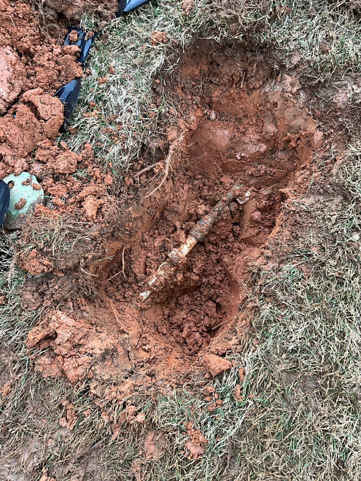 Call for leak in yard.

Arrived and met with James. He states that a leak was noticed yesterday in the yard near the water meter.

Inspection shows a tee off nearby for irrigation. I discussed possible costs depending on pipe size and James elected to move forward with digging up and exposing line. Once exposed I found a pvc compression fitting leaking. I also found a schedule 80 pvc female with a threaded copper male. I removed both connections. I also removed tension off of the waterline by offsetting pipe.

Pressurized and checked for leaks. Water pressure static at approximately 60psi. Water heater is a gas AO smith unit from 2018.

Ms. Caymen also mentioned that the bill spiked around fall some time, and I believe it’s possible that the leak may have been developing at this time.

I recommend contacting the water service provider for a bill adjustment now that the leaks have been resolved.
