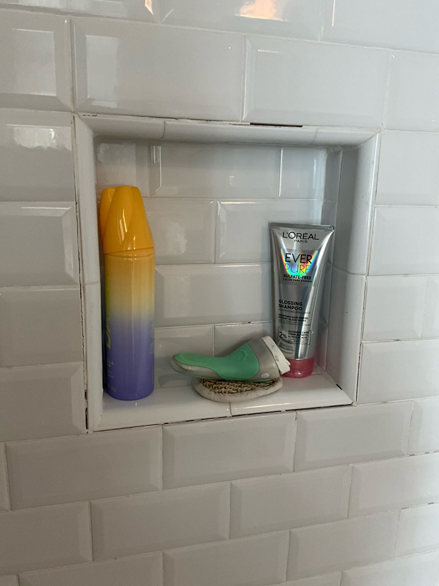 Call for leak in ceiling under shower, and various plumbing concerns

Arrived and met with Jeff and Kelly. Jeff states that they noticed water dripping from ceiling after the shower was ran for an extended period of time. He also showed me a loose handle on a faucet, a soap dispenser tube that was broken, and a loose p trap.

Inspection findings:
Tub/shower leak: inspected plumbing and found drains are secure and tight, overflow is fine. No loose tub spout, handle, shower head or escutcheon. I did find missing grout on several spots of the tile, including around the niche nd on base of tub. It looks like water may have accumulated on the floor and seeped down, or from the gaps between tile. I recommend a contractor be contacted to assess tile and surround. Due to the large gaps and likely hood of water from here, we did not cut walls or ceilings to inspect inside the closed spaces.
 
Powder room faucet handle is missing a set screw, and the stem was not seating correctly. Jeff was unde