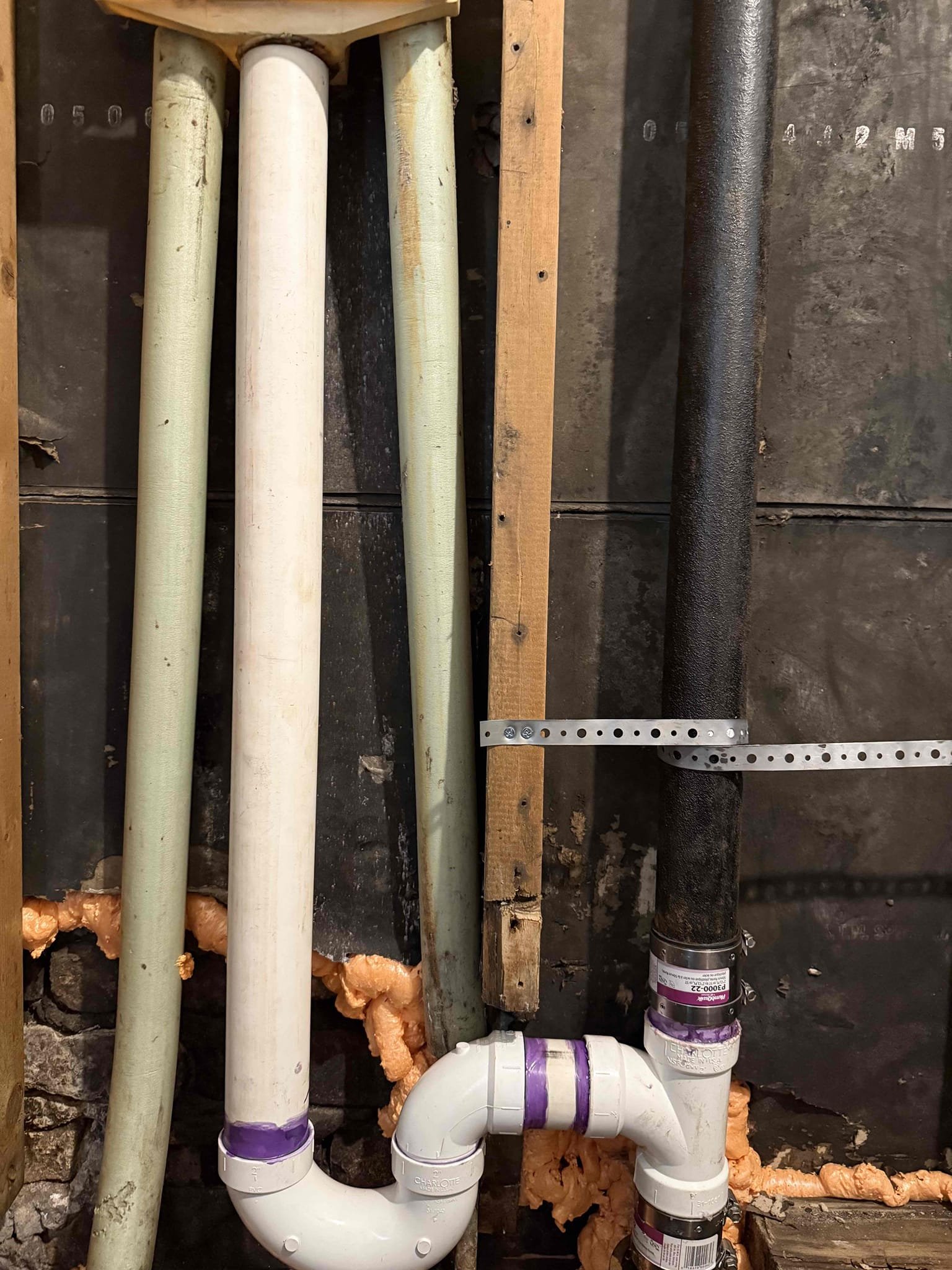 Returned to cut out cast iron laundry p trap and stand pipe all the way to the stack and replace with new pvc. Cut out old cast iron and replaced it with 2 inch pvc. Ran small sewer machine down the line to make sure there was no further blockages. Ran water for 5 minutes down the line to make sure was clear and no longer leaking. Line no longer is backing up and is flowing properly. No leaks upon departure.