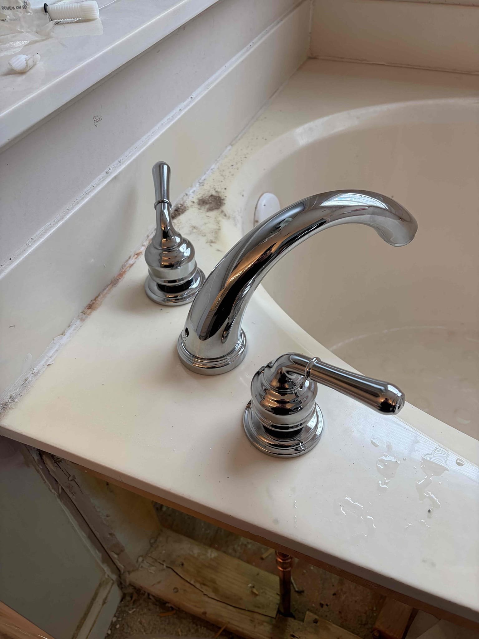 For this customer, we install a customer supplied Roman tub faucet in the master bathroom. We had to remove the board that goes in front of the actual tub kind of like an axis panel remove that and I told the customer that we are going to have to remove it to replace the faucet so that is exactly what we did was able to get the old faucet out how to cut off the old faucet because of the age got it all out and was able to properly get the new one installed It came with these flexible connections that are required with the faucet in addition to that put all the trim on correctly and everything together, so it would be proper. The customer went with an Olympia faucet after the installation I cleaned up with my shop vac all the dust and debris that was created in all the brush shavings and made sure everything was looking nice and new in addition to that the customer also had a half inch gate valve in the basement for a hose bib that he needed to be replaced so therefore that is exactly wh