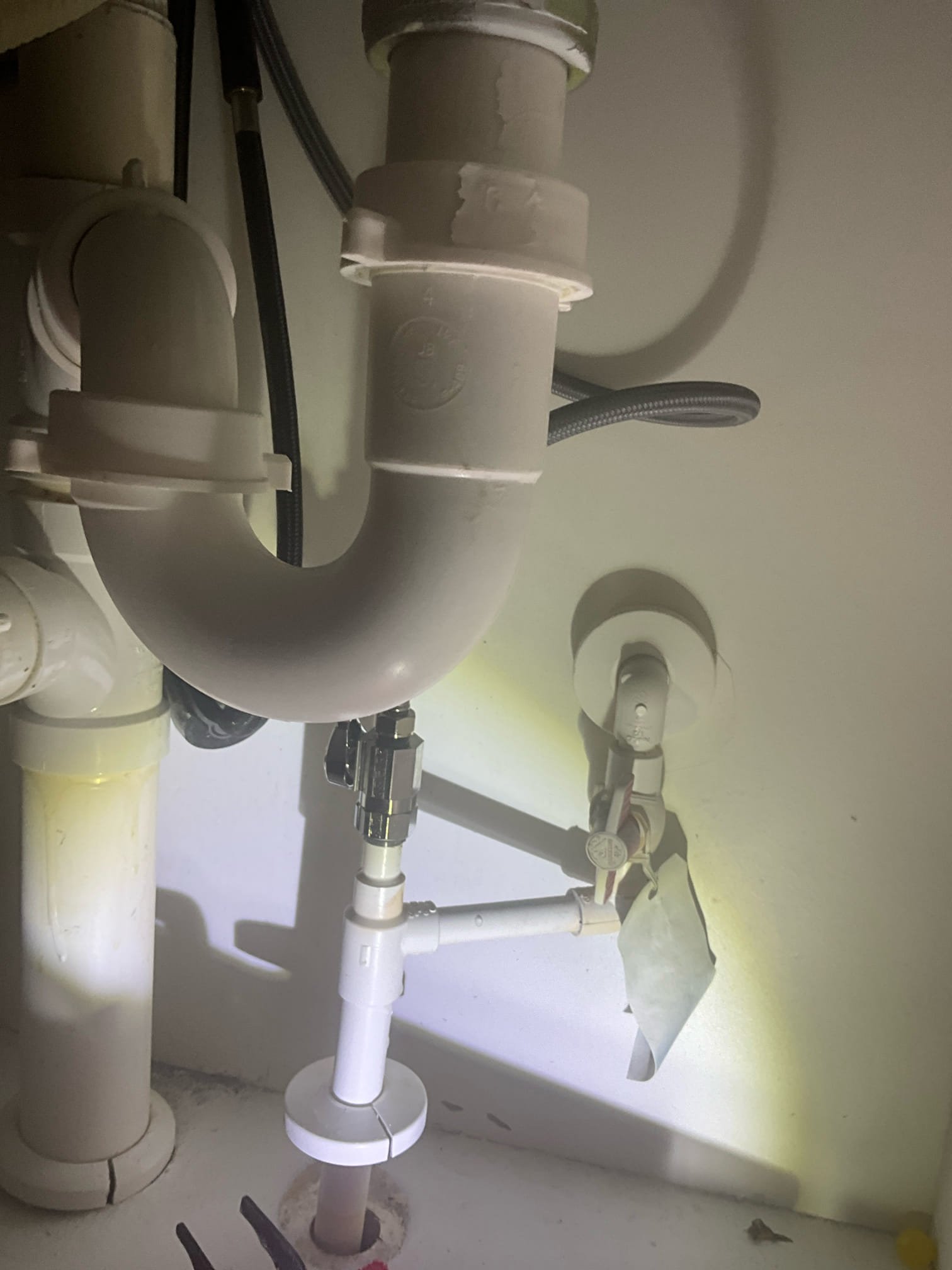 Customer had a stop for the kitchen that was broken. Stop started leaking when I inspected it. Replaced the stop as a courtesy since the inspection caused the leak. Turned on front hose bib. Water heater installed in 2024. 