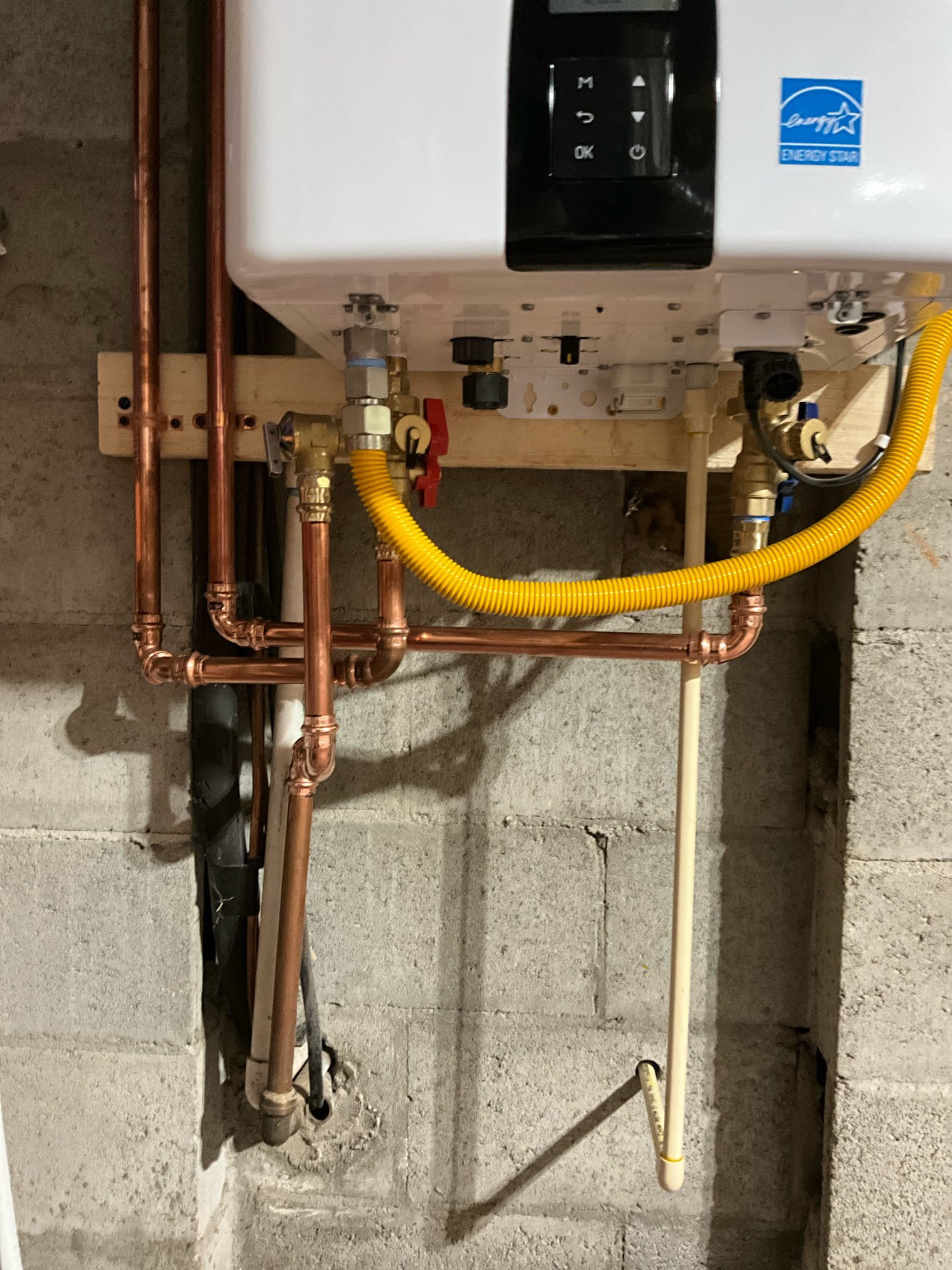 Return to complete quoted tankless replacement.

Removed Rinnai tankless and installed new navien tankless water heater.

This included reconfiguring waterlines, gas lines, t&p, adding a condensate drain line, and applying concrete around exhaust line.

We also capped an old gas line as a courtesy at Nathan’s request. 

Navien was turned on and calibrated. We found a dripping tee on a sharkbite and replaced this as well. 




Notes for Shawn and Christian:
Electric in place. Hole for exhaust is for concentric 4 inch line, bring escutcheon. Copper waterlines. Prv only a couple years old. Gas already correct size with adequate valve. 