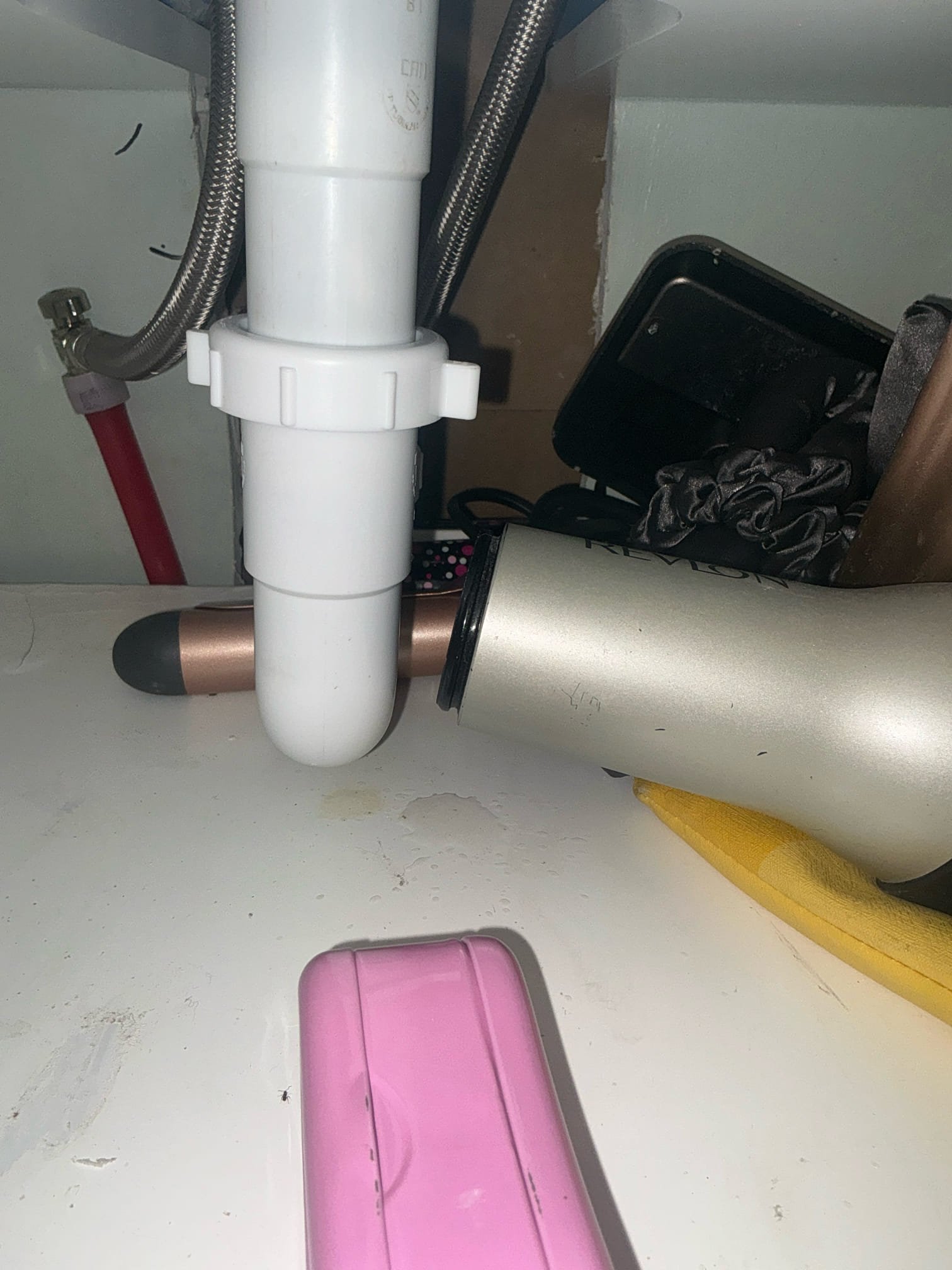 Found lavatory pop up assembly leaking in hall restroom. Removed pop up assembly and inspected for damage. Found putty was missing in a section. Puttied pop up assembly and reinstalled. Filled lavatory and drained to test pop up assembly. Advised customer that it is not recommended to flush water heater due to age. Checked toilet for leaks. No leaks at this time. Dan gave authorization over phone.