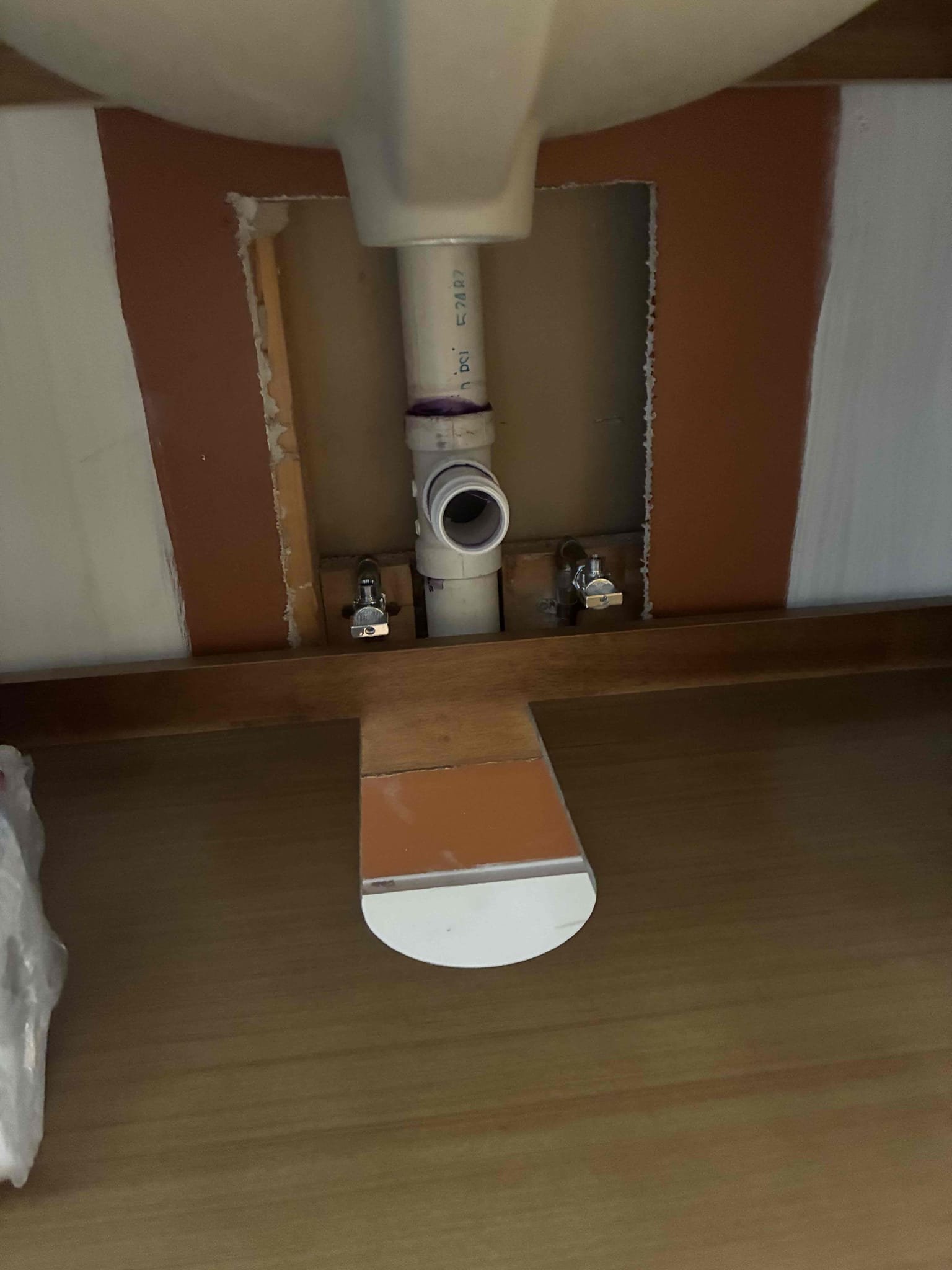 Customer had drainline interfering with new vanity placement. Gave options to alter plumbing. Cut wall to move drain work up a few inches in order to allow for vanity to set. Also replaced both stops to update hardware. After work was complete, checked for leaks and proper function. 