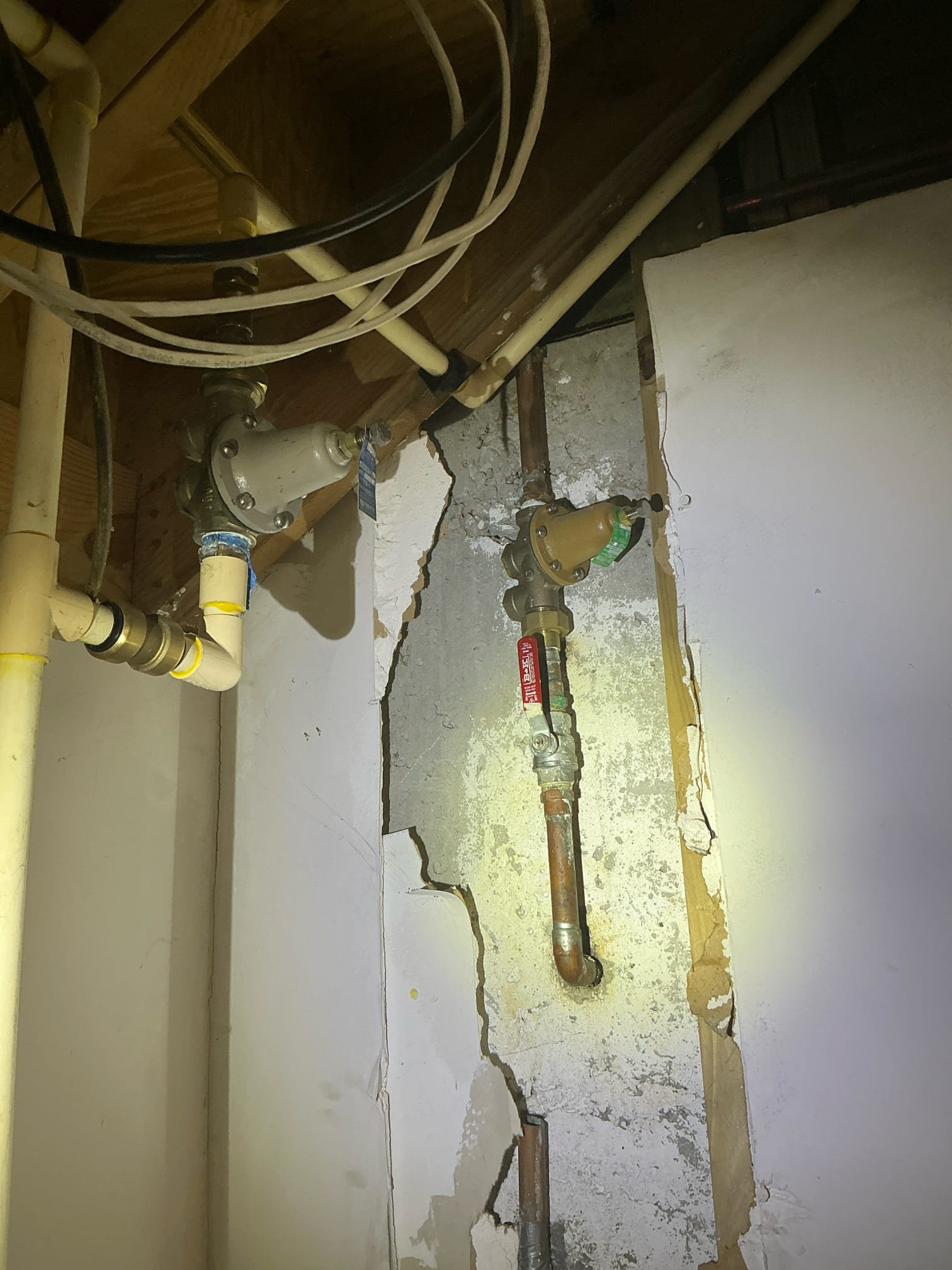 Client called us out to check out a few plumbing issues in the home that is about to be listed for sale. There were a few different issues we addressed. 

The home had 4 different water pressure reducing valves for different sections of the home. This is not normal or correct. Water pressure was high on one side and not on the other side of home. We cut out those unnecessary pressure reducing valves and then piped the pipes back together. We added a new 1” pressure reducing valve and new ball valve shutoff in crawlspace area. We also added 2 isolation ball valves on the 3/4” lines running to other sections of home. 
Other repairs we did was rebuilding a Toto toilet with new fill valve, flapper, and braided supply line due to it not filling as it should. We also replaced a pop up assembly in the basement guest bathroom lavatory sink, and fixed the slinky drain in the car room bathroom. Turned water back on and all good. 

Client does have a copper line leak under the concrete slab of ho