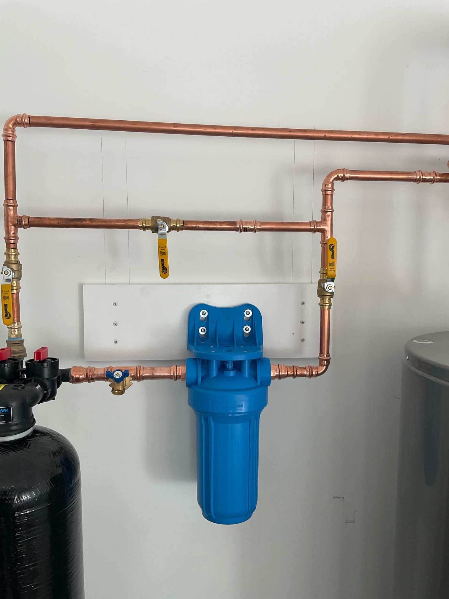 Redid house filter pipe and fasten post filter to wall to stud 