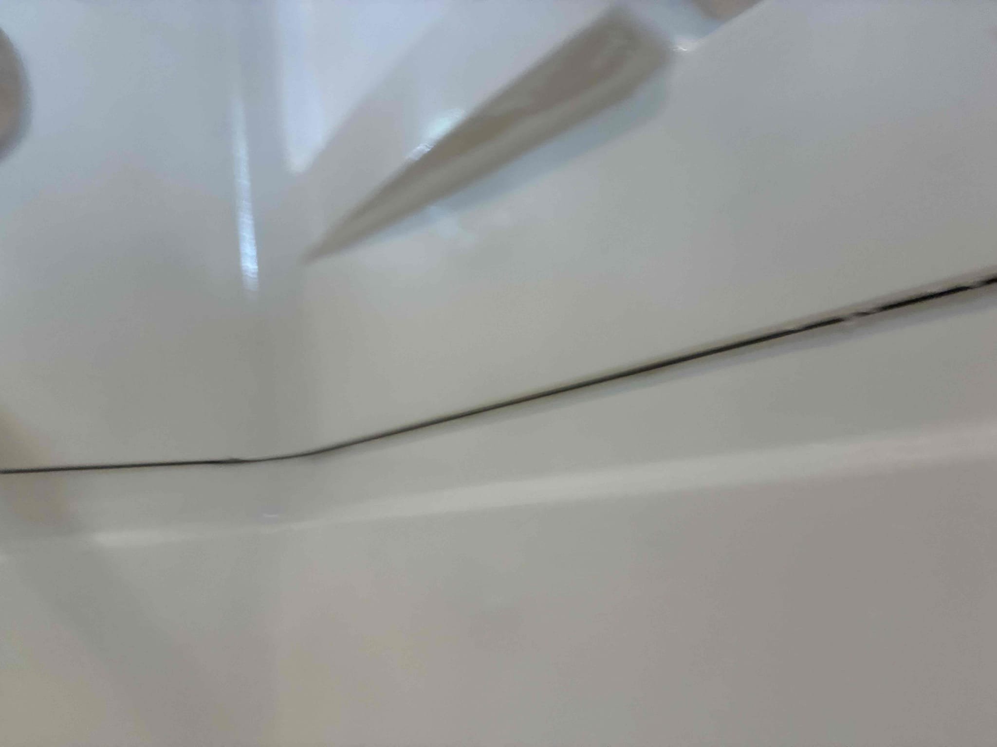 Customer had debris coming from behind shower walls when showing. Gave options for repair on issues and additional options for various other work. Caulked seams between three piece shower and Informed customer on dry time. 