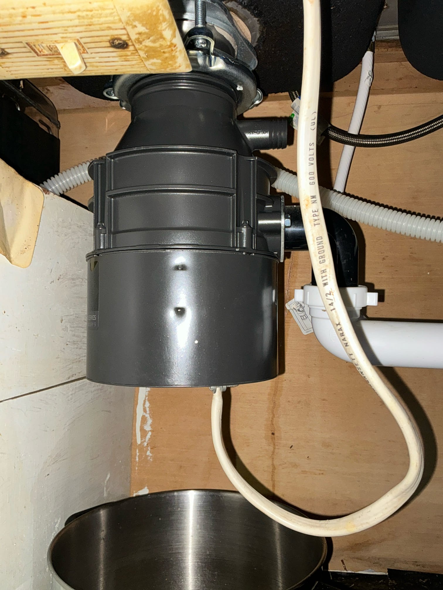 Remove old leaking garbage disposal and collar. Install new garbage disposal and test for proper operation and leaks 