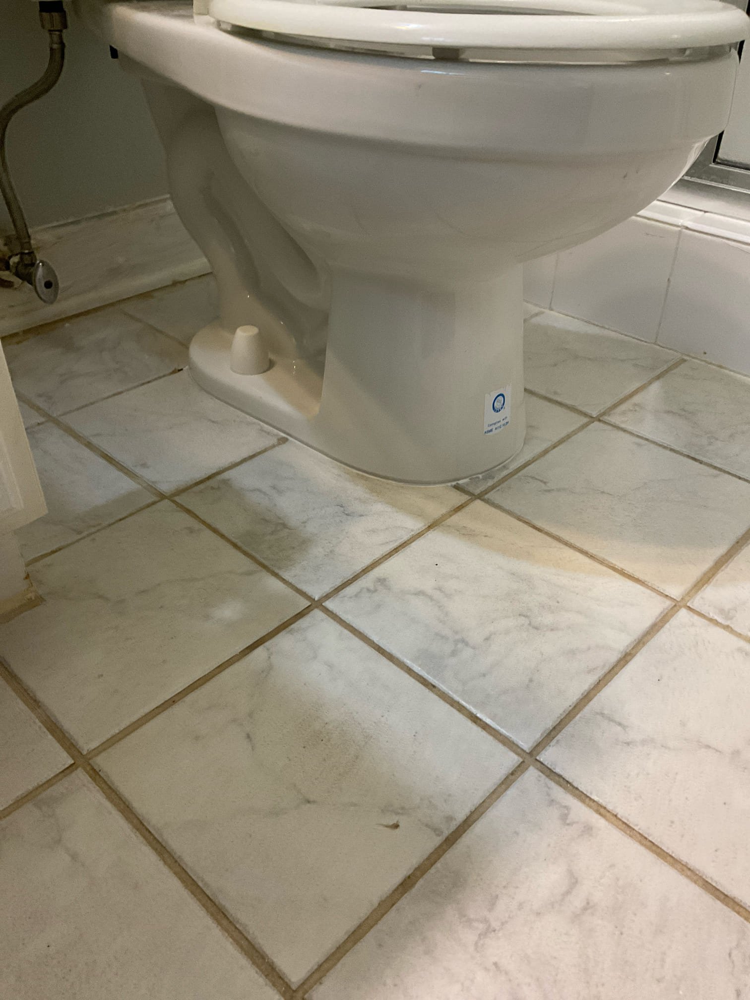 Fixed wobbly toilet with shim and caulk around base , tightened tank to bowl as well 