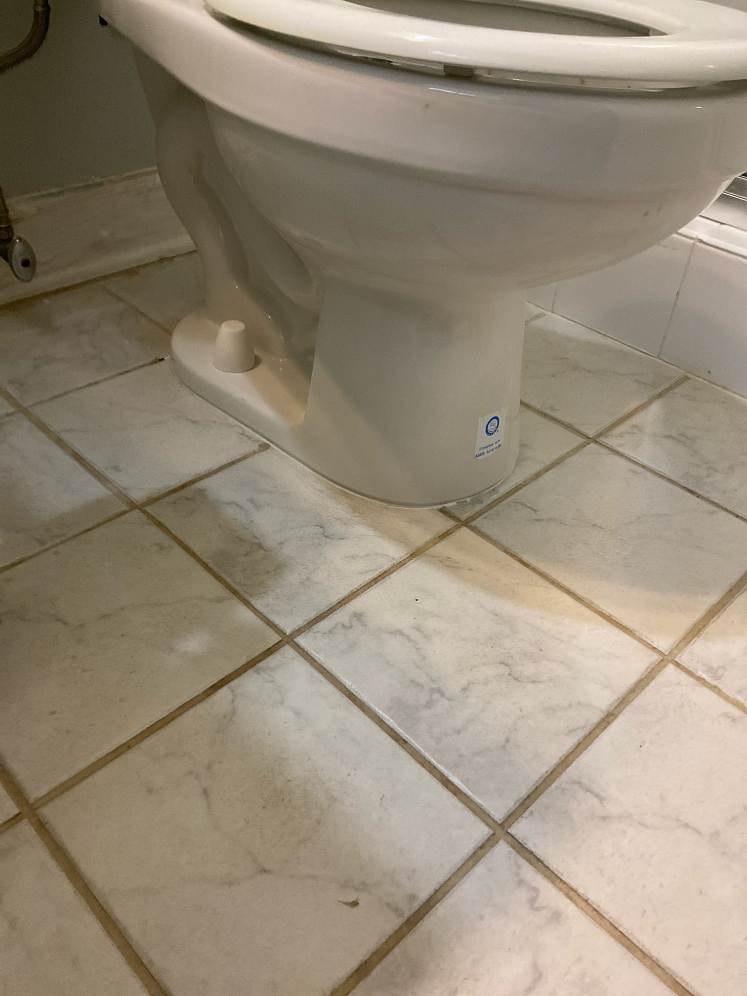Fixed wobbly toilet with shim and caulk around base , tightened tank to bowl as well 