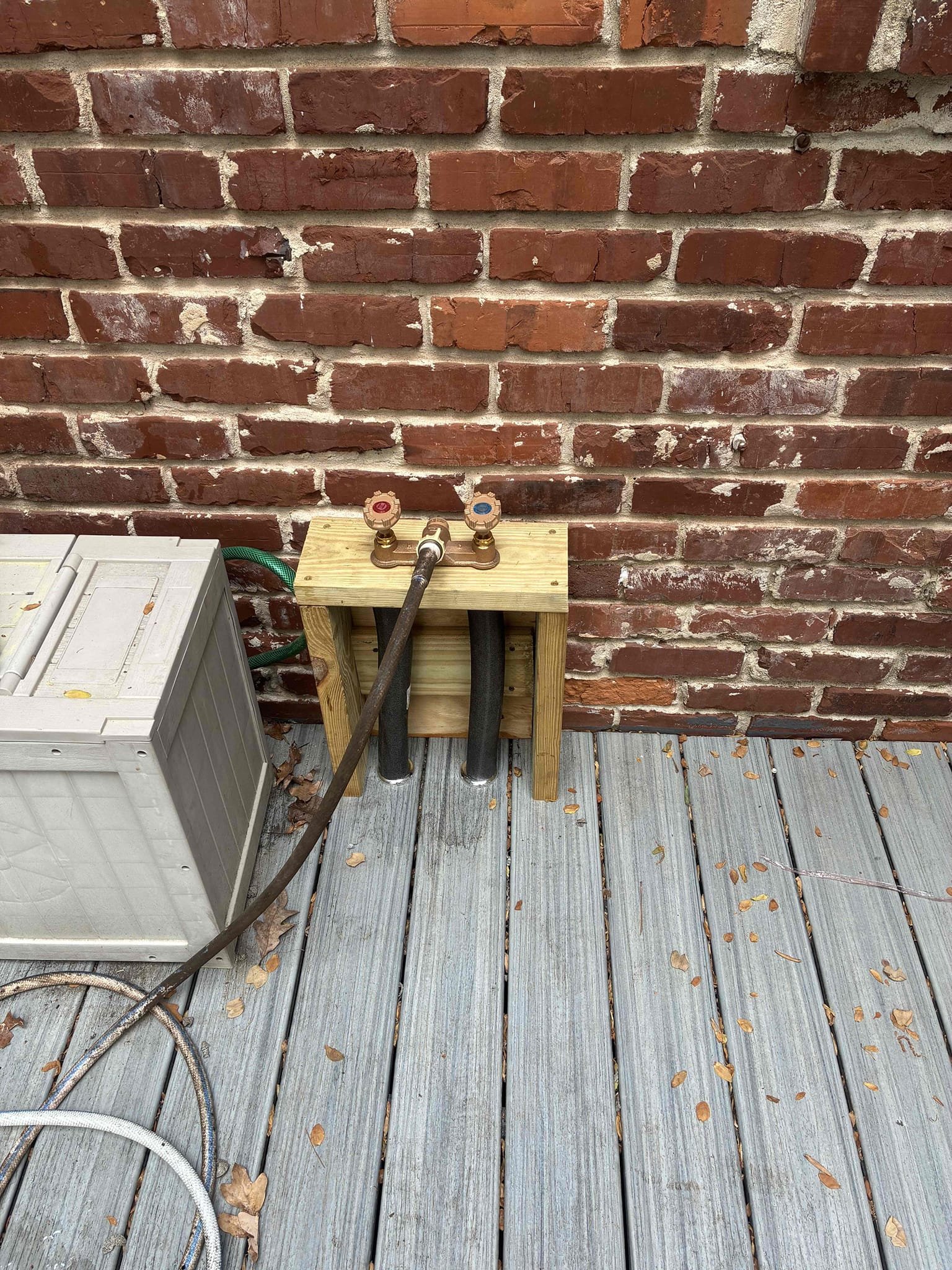 Customer wanted to replace customer hot cold hose Bibb located outside with actual hot cold yard faucet. Gave options for replacement. After securing faucet to custom wood work. Re attached hot and cold lines to fixture and tied into existing lines. Checked for leaks and proper function. Not responsible for custom wood work. 