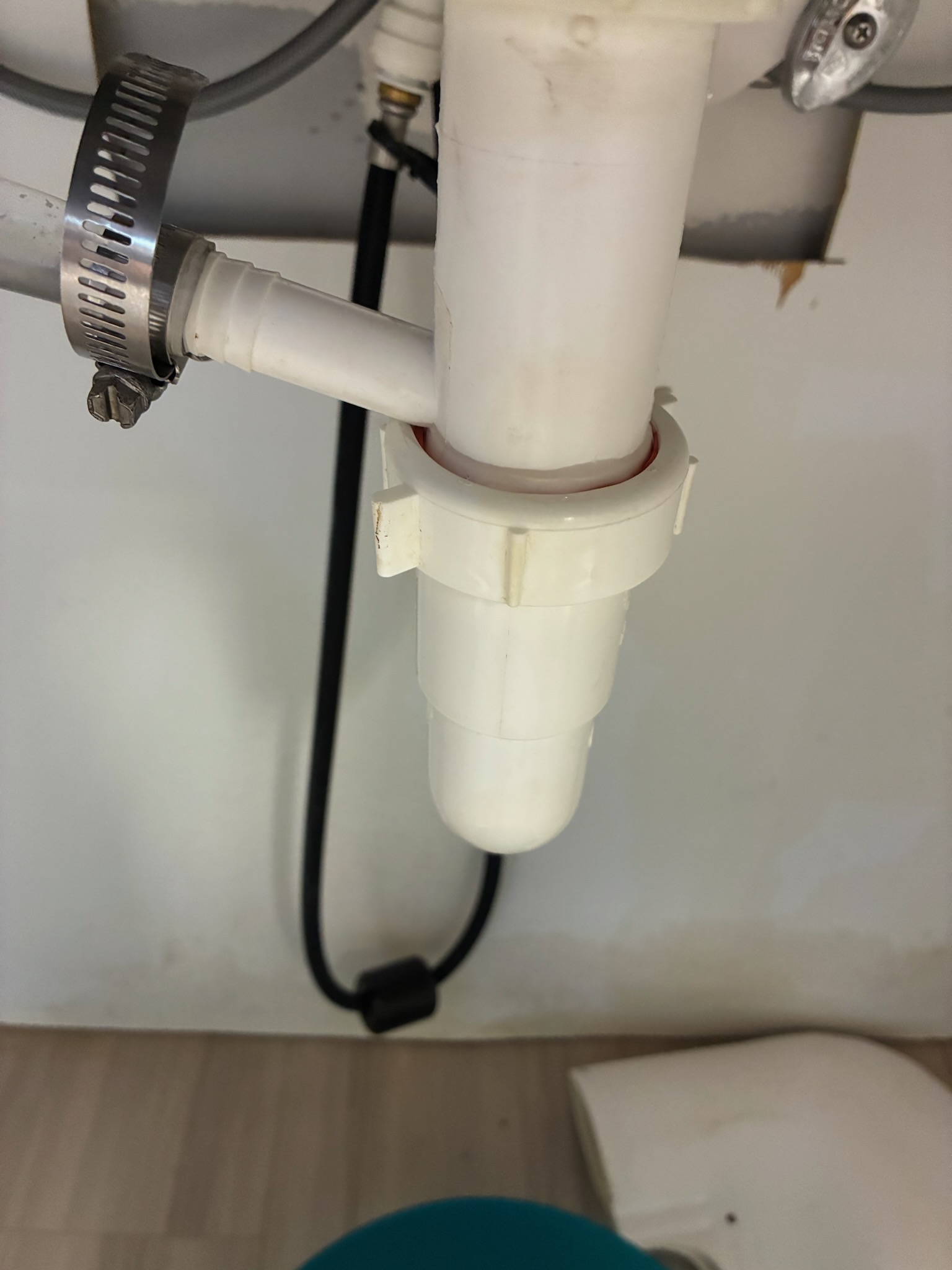 Call for drain leaking after ice maker installation.

Arrived and met with Chad on site. He states that after a vendor installed an ice maker they noticed a leak under the sink.

I inspected the sink and found that the trap was leaking from the ice maker branch.  Due to the height of the drain exit in the wall, the sink configuration, and space restrictions we were not able to install a dedicated p trap for the ice maker. I replaced the nut on the basket strainer, and reconfigured the p trap to accommodate the ice maker condensate line.  This work was done under warranty.

During this we also discovered the line was backed up again. 

I used small auger and bent in a Z to scrape coffee grounds and residue off the interior of the pipe walls. Inspection camera used to verify as far as possible. Due to configuration of drain lines we were required to cut vent line in ceiling to auger the drain further. Drain was cleared, water ran for approximately ten minutes to verify no further blockag