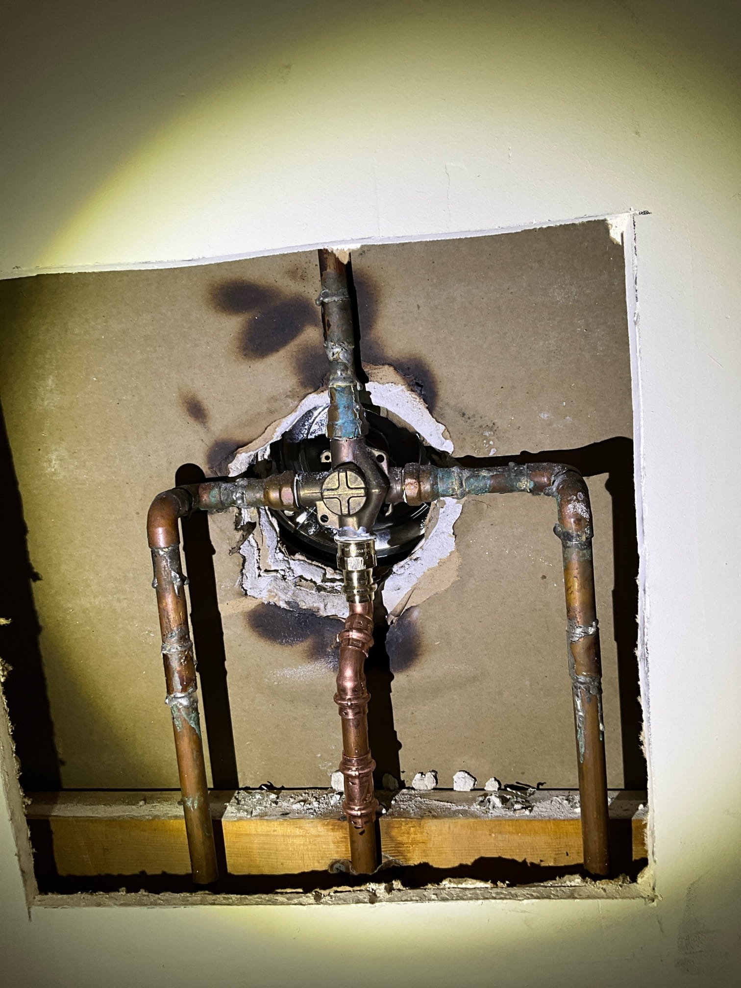 Call for water in ceiling after recent shower cartridge repair.

Arrived and found water leaking from kitchen ceiling. Water was still on to home. It was stated that when the shower was used they noticed water, but not when the tub was used.

I inspected the shower by removing the escutcheon and trim. When carefully testing we found the copper pipe going to the tub spout was not all the way in the female fitting. Photo is on file showing the pipe, and you can see the solder line. The spout pipe was bent at a hard angle and putting tension on the improperly soldered joint. We also noted poor soldering and damaged pipe at other sections of this shower valve.

We performed a repair at no cost as a courtesy and demonstration of our commitment to quality customer service. We have contacted Provision Restoration and they have arrived on site and are taking care of the drying and repairs at no cost to the customer. 

We tested all functions of the shower and tub, ensured no leaks were present