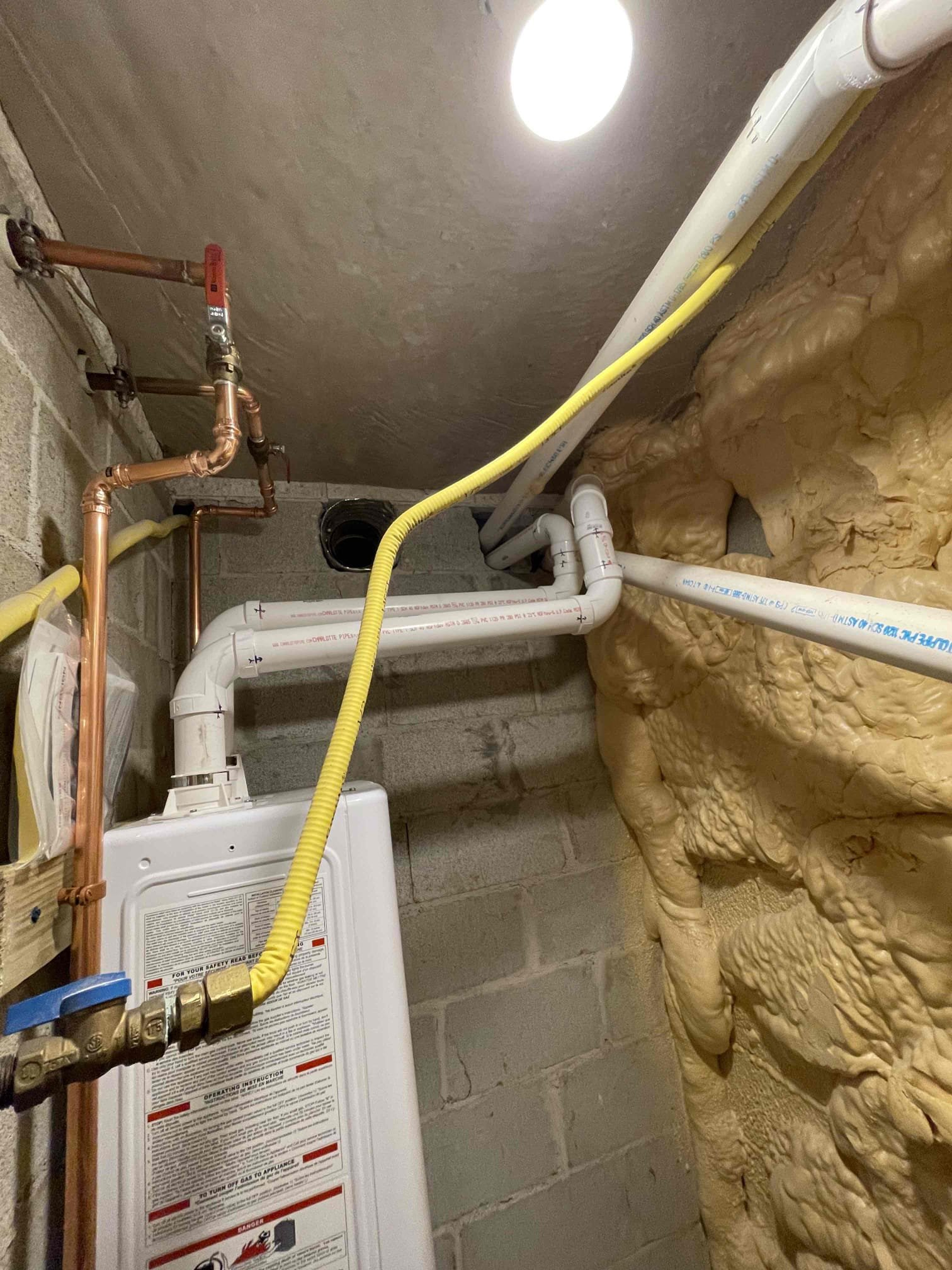 Replaced PRV. Set new pressure to 70 psi. Removed two tank water heaters and installed a Navien 240A2. Cut open the ceiling in the bedroom next to the utility room. Drilled two new holes through the foundation and ran my air intake and exhaust outside. Installed crossover valve under the kitchen sink. Tested to ensure proper function and a leak free installation. 