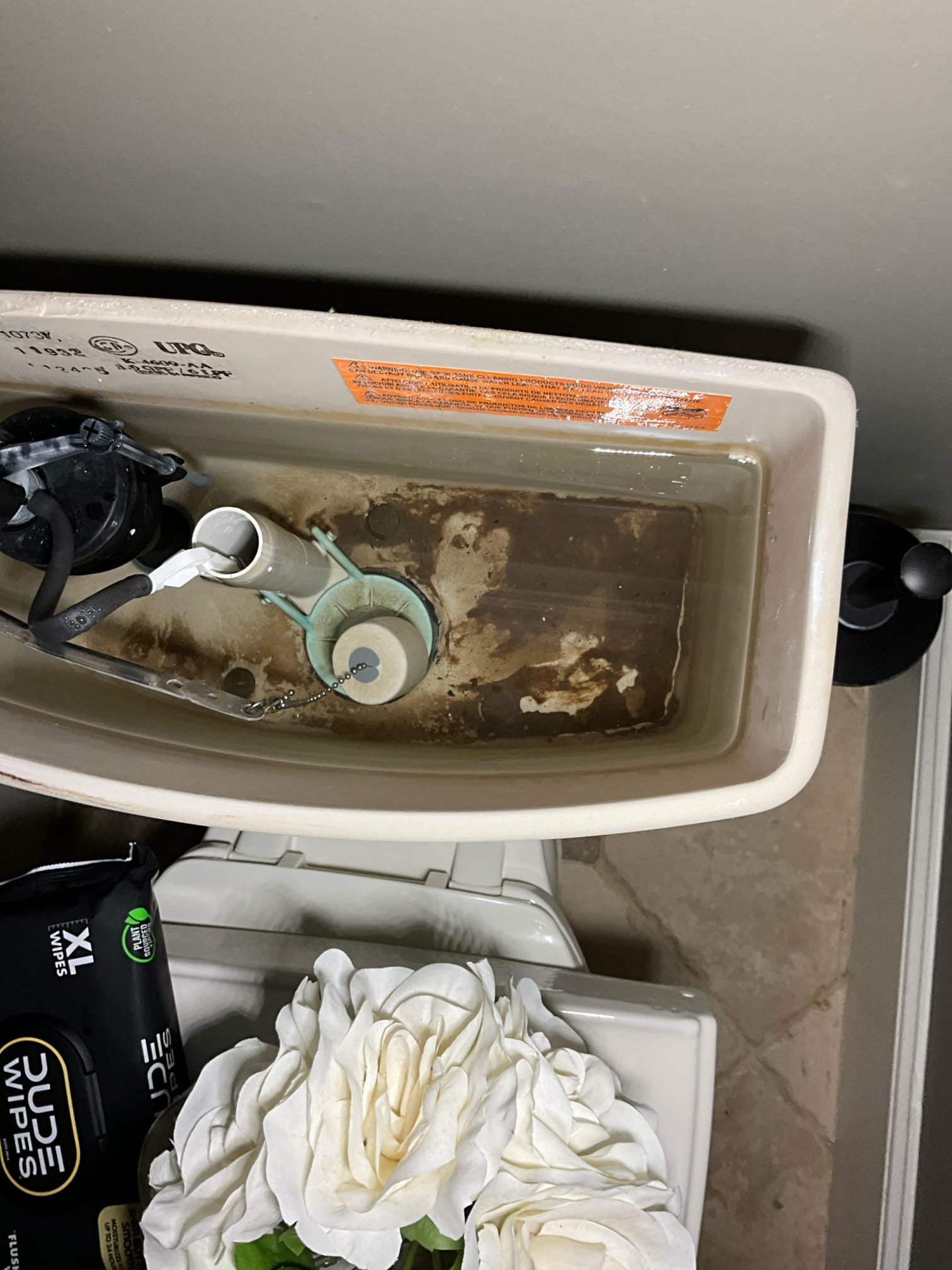Call for toilet leaking in to ceiling.

Arrived and met with Ryan, he stated his children saw water damage in the ceiling. He checked the toilet above and found a tank dripping to the floor.

I inspected toilet and found the tank components to all be in a very deteriorated state. The gaskets, flapper,  flush valve gasket and fill valve gaskets are all in bad shape. 

During the inspection we also checked three other toilets and found the. To be consistent with the first toilet. The remaining shut off valves however should be replaced, while the first is a good candidate for a rebuild. 

The house shut off valve is in working condition, and the pressure regulating valve is in good condition and working correctly. Due to time constraints we are returning tomorrow to perform all repairs.