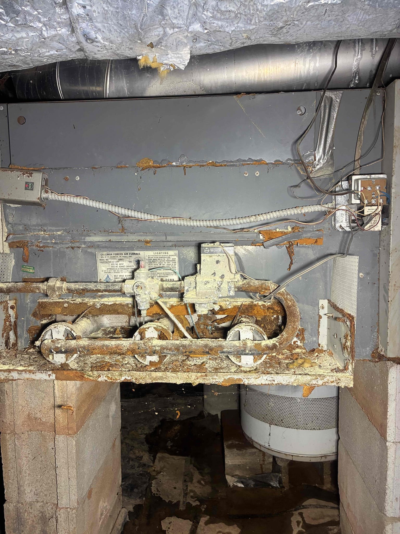 Customer called with complaints of no hot water. went down into crawlspace where heater was located and found heater to be busted and leaking into crawl. Explain to customer only way to fix is to replace tank gave options/repairs in order to address issues also found no PRV on home pressure to be at 120 psi. Replaced water heater with new rheem 40 gallon water heater and installed new PRV. After work was complete checked area for leaks and proper function. Pressure is now set at 60 psi.