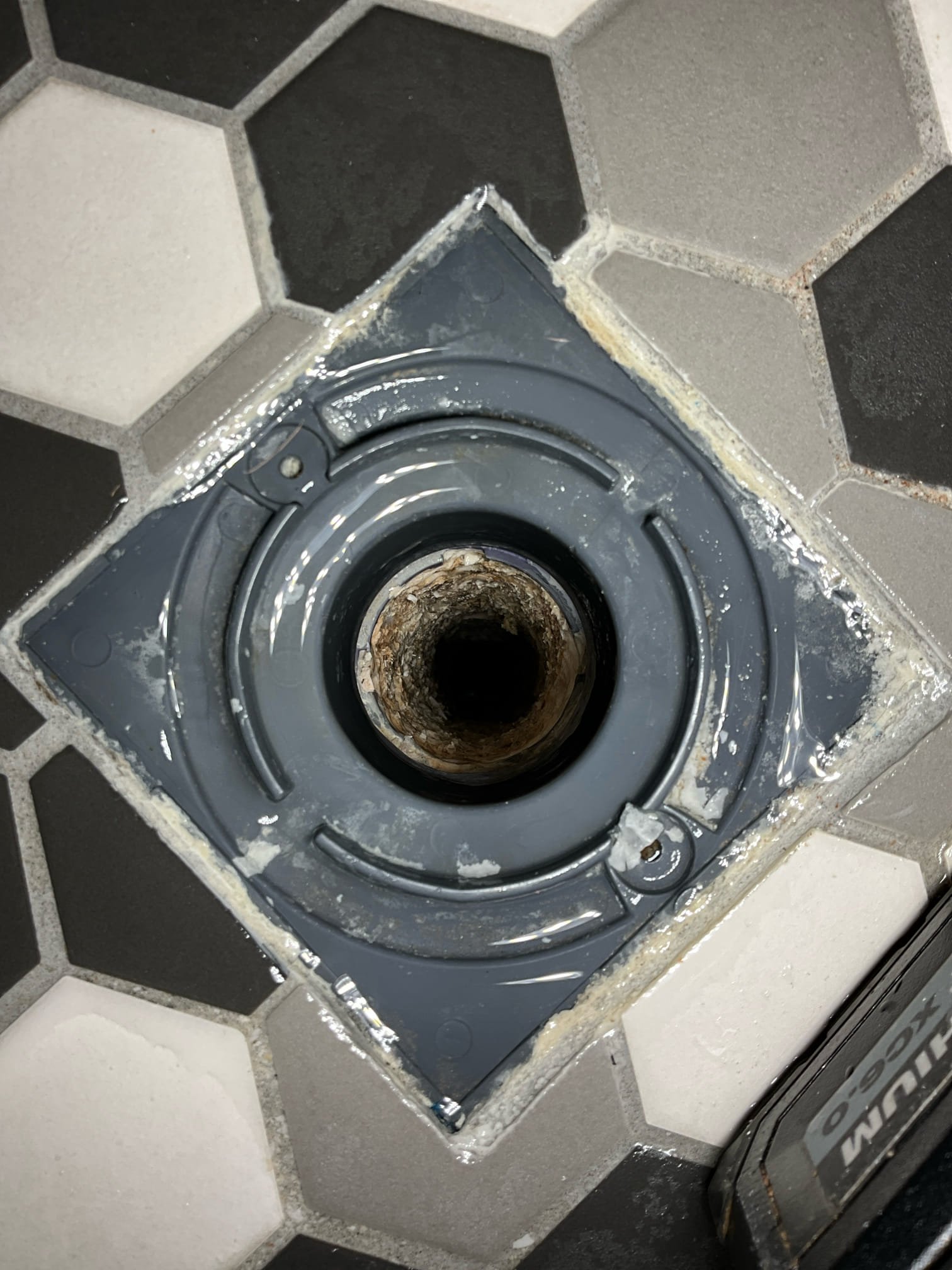 Call for slow shower drain. 

I arrived and discussed concerns with Mr. And Mrs. Singh. They stated that we have been out before to clear the master shower drain (approximately two years ago). Shower was remodeled nearly five years ago.

I inspected and what a grout like substance occluding nearly the whole drain. Substance was grotty and sandy, but had some plastic feeling tubular pieces as well. I was not able to identify the issue. I contacted a general contractor to advise us on possible grout or tile issues that could cause this, and they advised that grout color cover layer may be slowly piecing. But that no other possible scenarios came to mind.

I discussed concerns and possible solutions with Mr. Singh. I stated that we could attempt to chip it off as best as possible and vacuum the bits out, if that didn’t work we would have to remove and reinstall p trap. 

We were successful in removing most of the blockage, with residual grit clinging to walls but not effecting draining.

