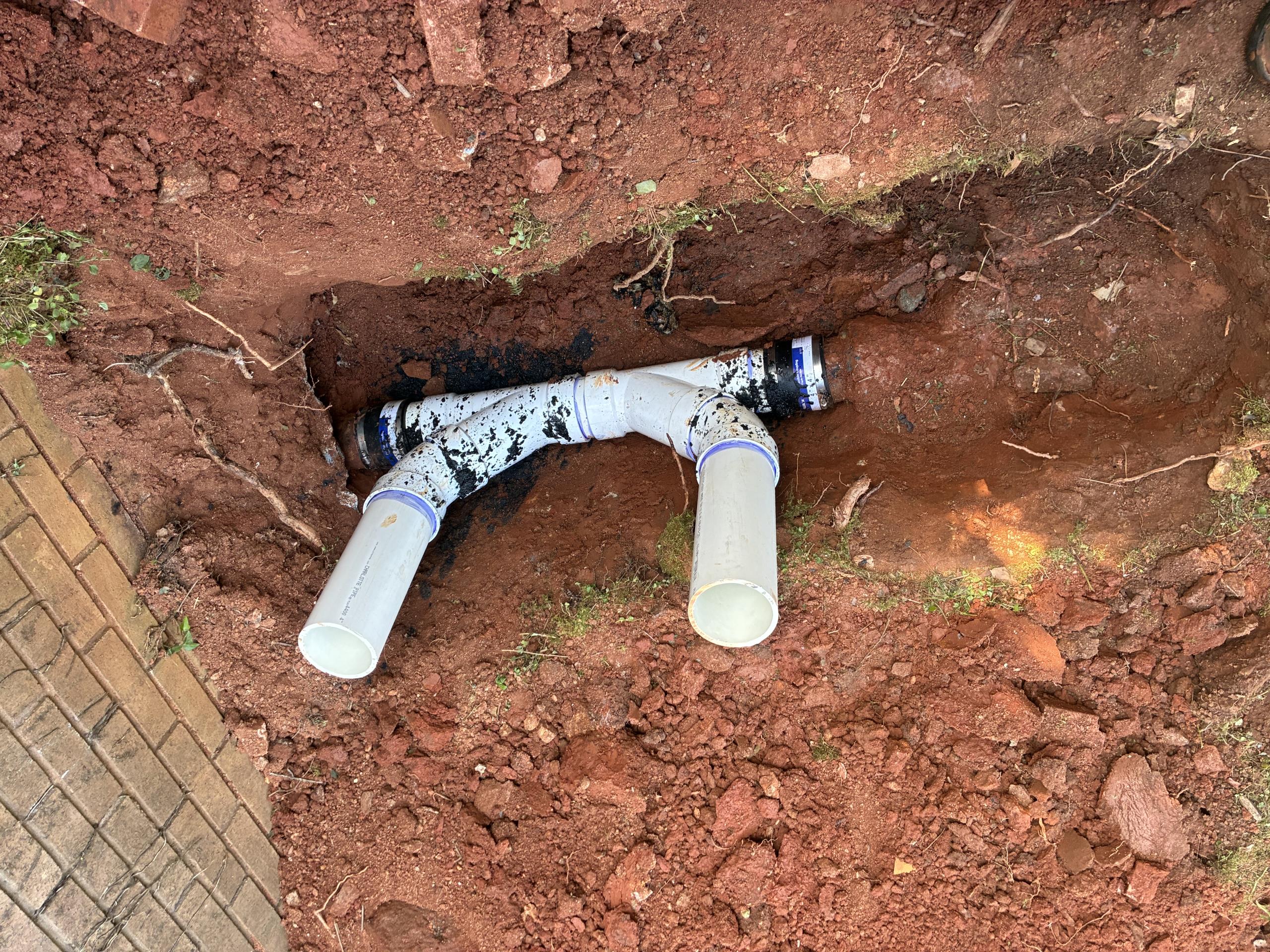 Return to complete quoted work as discussed. 

Two way cleanout installed in front yard, allowing access to home, and to mainline in yard. Camera inspection backward in to house not possible due to wye fitting. Camera inspection of mainline reveals that the mainline transitions from cast iron to terracotta within only a few feet of the cleanout.

Lines were jetted and cleared as much as possible. A significant clog was found where line passes from under the foundation (wye fitting with street 45 to home).

See previous days invoice for additional notes and discussions.

All work complete, main lines and fixtures flushing and running fine. 

