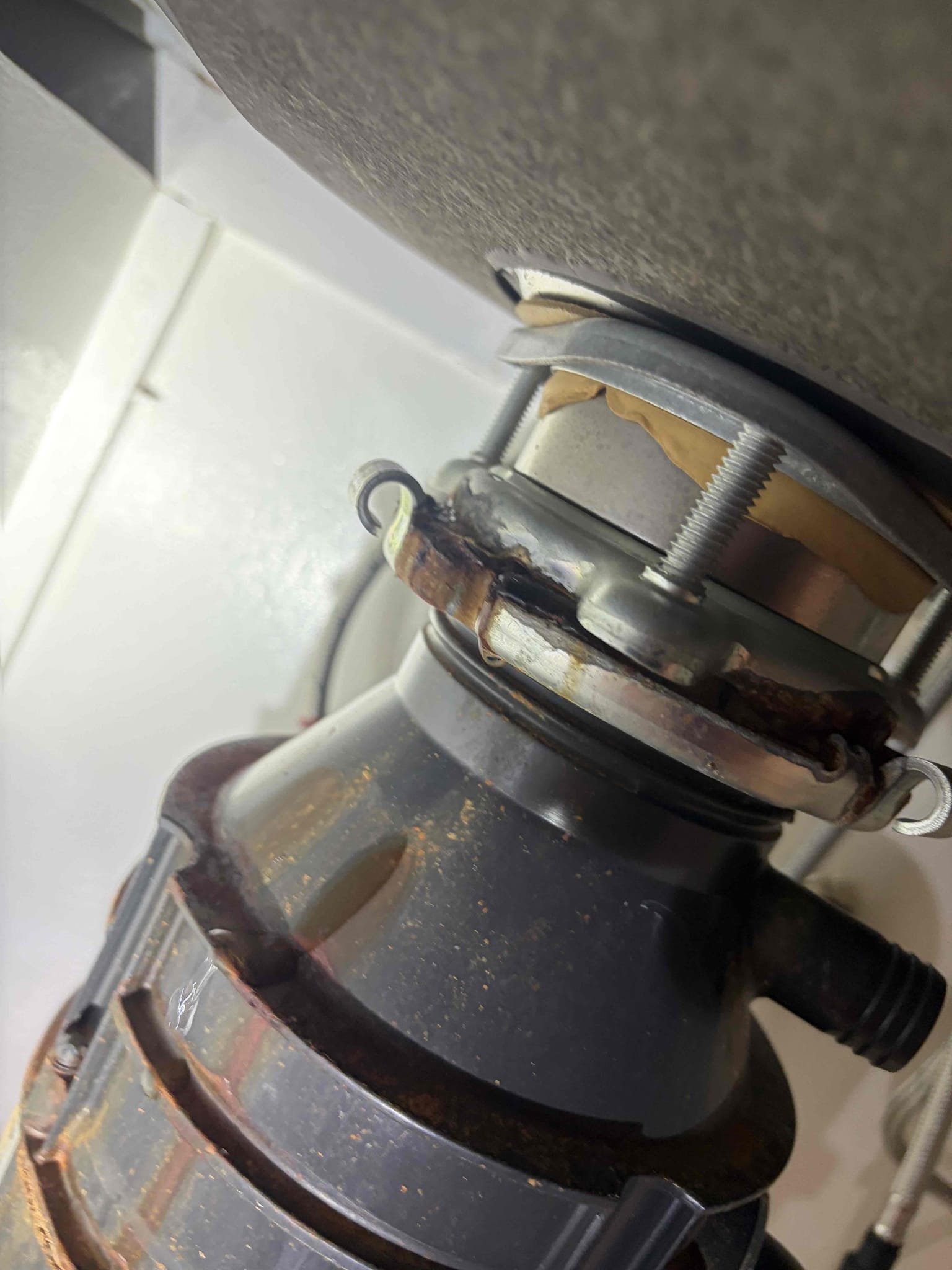 Replacement of 1/2 hp garbage disposal.

Installed a new 1/2 Garbage disposal in the kitchen, the previous one that had leaked so we went with a new one. In addition to that we checked the water pressure, the water pressure is all over the place, however I think it is at 55psi. I think the water heater is from 2016, however there isn’t a date code. Recommend to get that replaced sooner than later. At this time, the garbage disposal is now in. New wire nuts, new gasket and new everything this customer is all set.