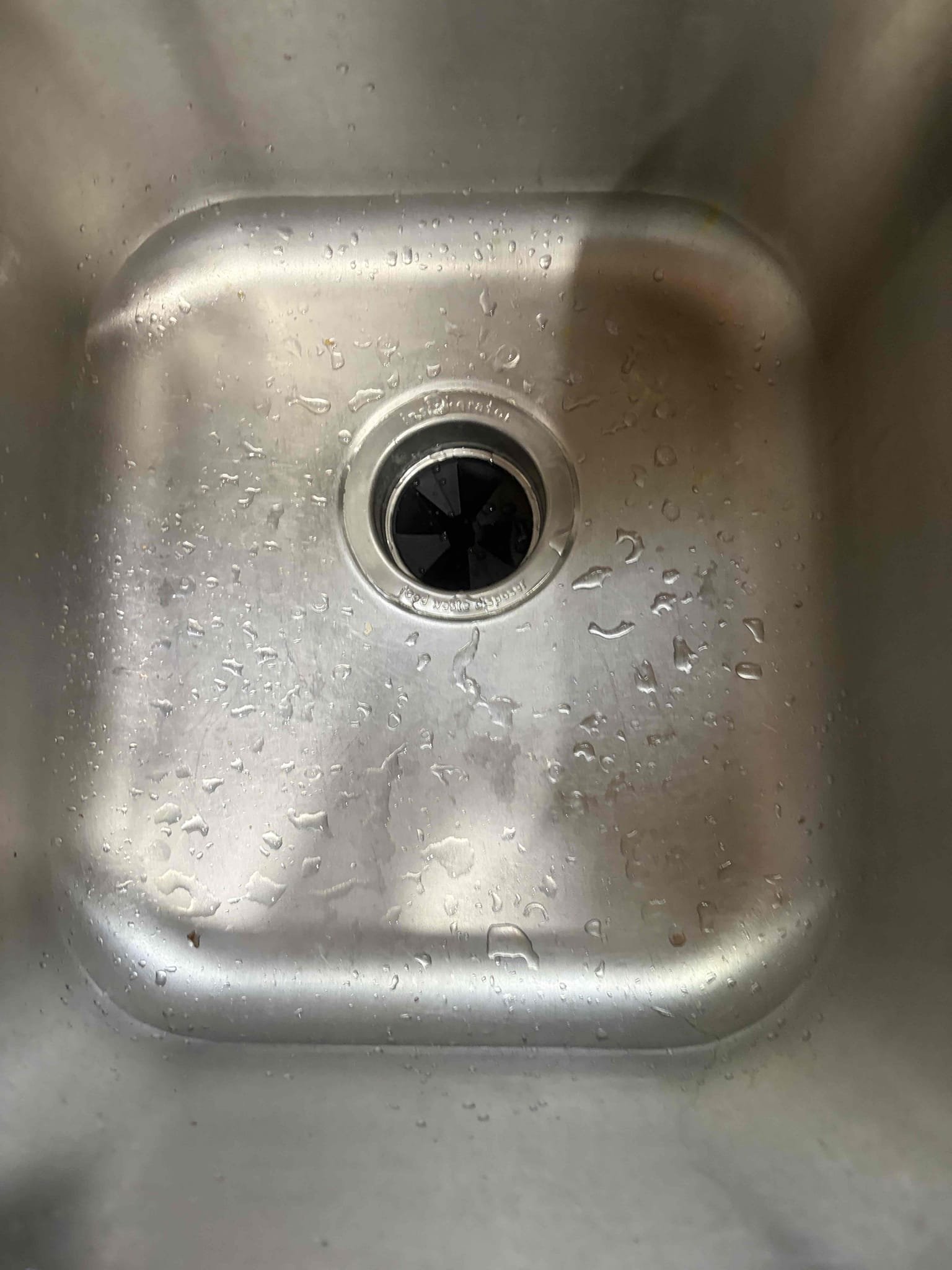 For this customer came out to their home for mysterious leak underneath their sink. It would only happen every once in a while and when I got there, it took a look underneath the sink to figure out where that leak is coming from narrowed down to the garbage disposal because there is a small drip coming from the disposal itself so therefore that is exactly what we ended up replacing today. Start a new half horsepower garbage disposal along with a New P-trap to finish the project installed two new wire notes for the positive in the negative attach the ground wire to the green screw follow that knocked out the plug for the dishwasher hose loop and install the new bracket with brand new putty once installed. There are no leaks in the customer is all set to use a brand new garbage disposal with no leaks. I did not look at the water heater because of their tenant in the basement along with the water pressure was not able to get a pressure reading today. 
