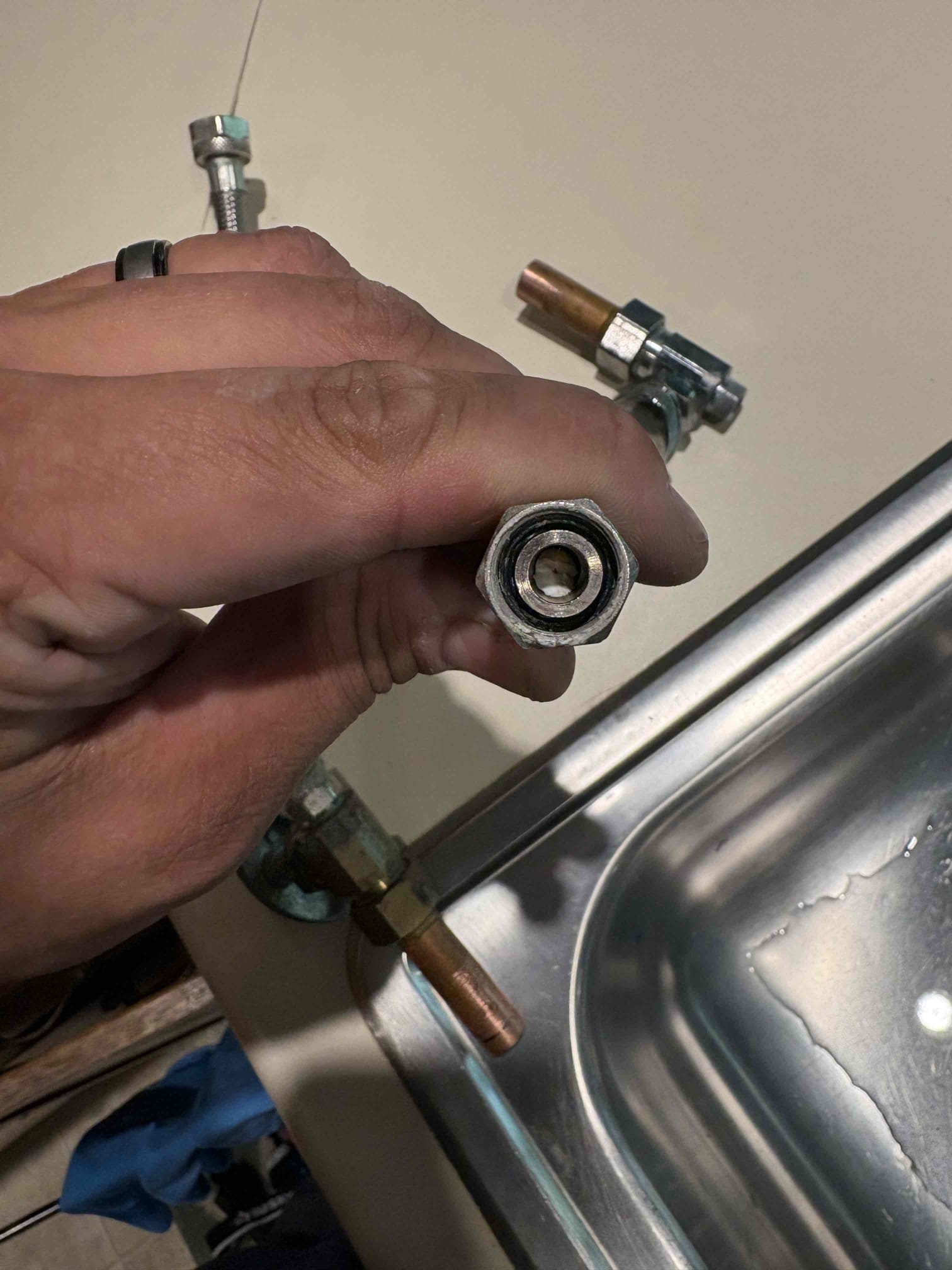 Installed new customer supplied garbage disposal, removed old one that was leaking. Upon work customer informed us that the hot side for kitchen faucet had low volume. Changed stop valves and found lots of build up there and in the supply lines. Also found kitchen faucet to be leaking. Shut off water and replaced hot and cold stop valves and installed new Chen provided kitchen faucet with new supply lines. Tested all work and no additional leaks found. Cleaned workspace 