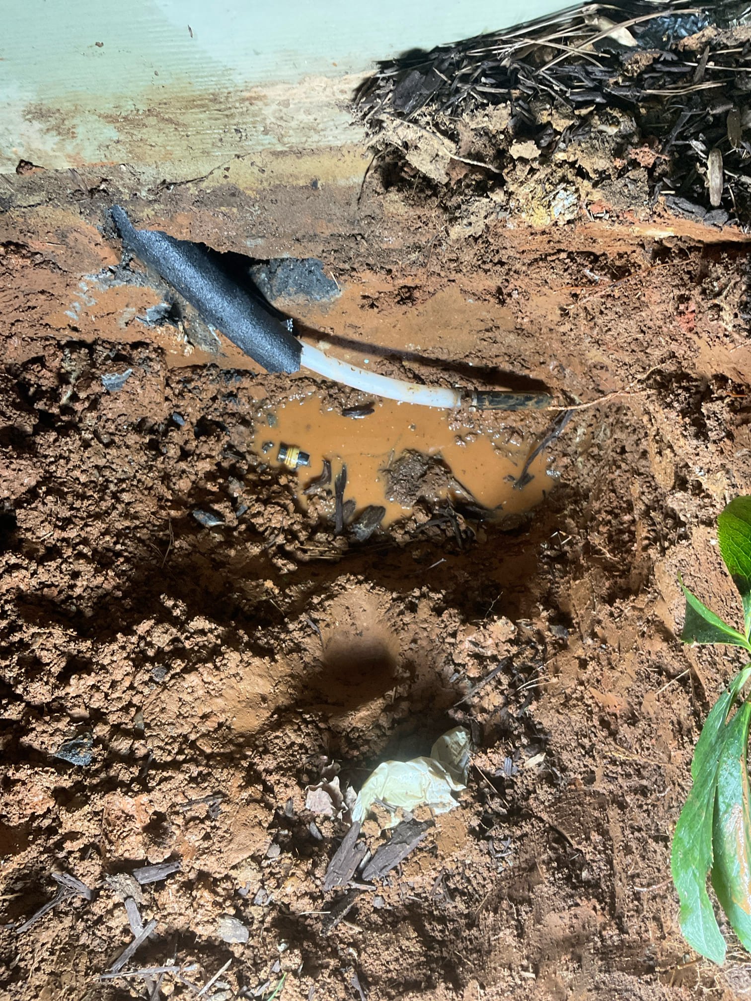 Water line leak under the slab and into garage floor , we used jackhammer break concrete and dig up outside fixed a broken sharkbite fitting 