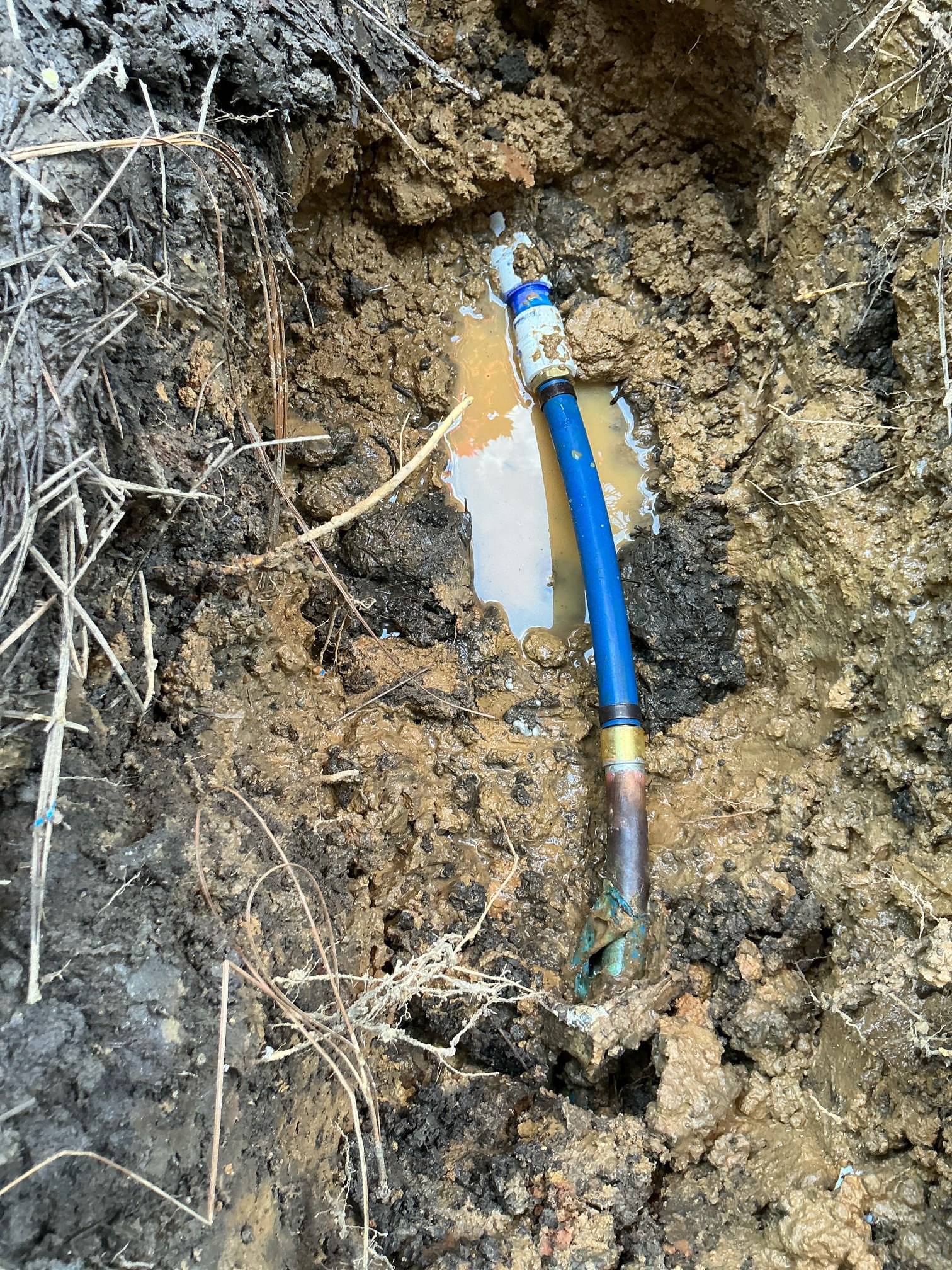 Found leak in yard on pvc to copper connection near front door. Shut off water to home at meter and cut out section of leaking pipe. Replaced section of pipe with pex. Tested for leaks. No leaks detected by meter