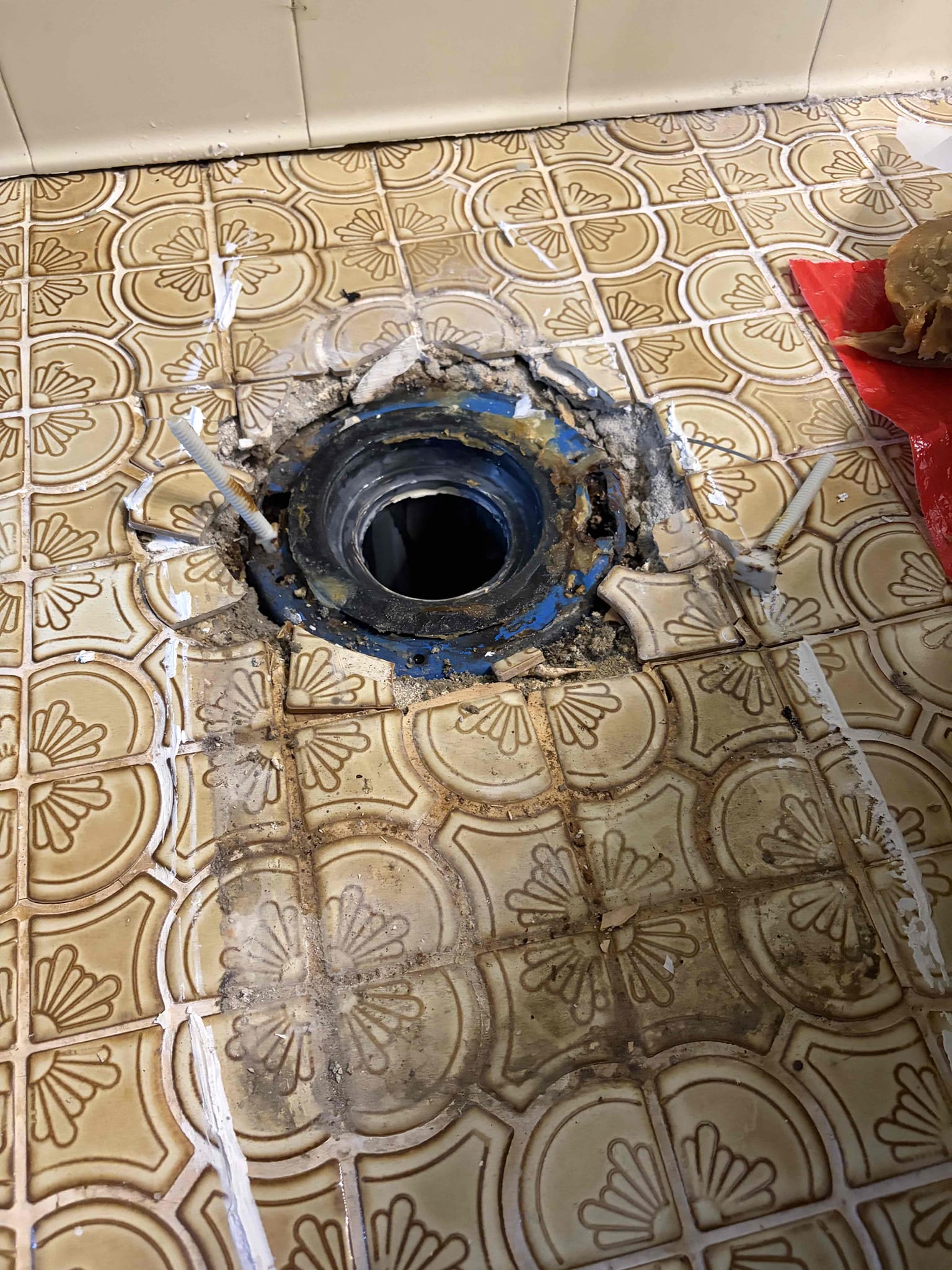 Will need to replace the flange, the tile is old and is cracking so it causing the flange to sit lower, the homeowner will need a contractor to remove the tile and replace the floor two part job that will need to take place, customer had a similar issue with the upstairs toilet. So therefore we were expecting potentially the same outcome. At this time the floor needs to be fixed in order to put the toilet back properly 