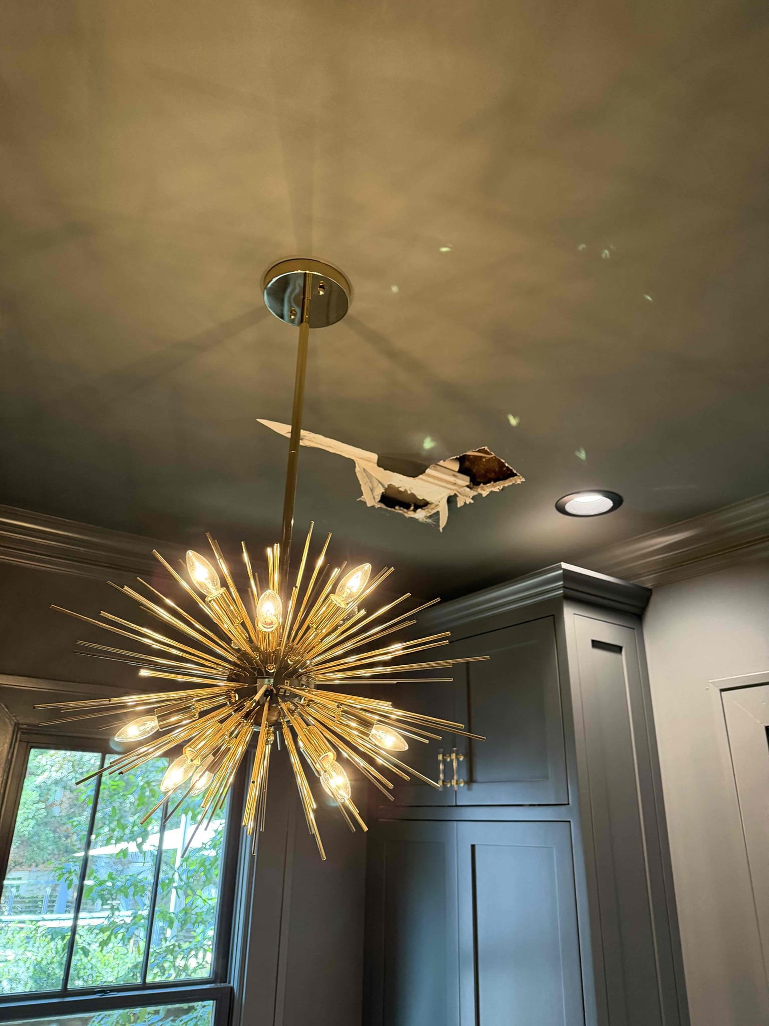 Customer stated that there was a leak in the ceiling and that water was shut off. Upon arrival found that she was wet in multiple places. Stated to customer that we will have to cut sheet rock in order to find leak. Customer greets went ahead and cut sheet rock in two different places and found pinhole leak on hot water line. Gave customer estimate to make repair and customer agreed. Went ahead and made repair on the hot water line and also made same repair on cold water line as a preventive. Turned water back on and tested, and no more leaks were present at this time. Also, customer mentioned that there is a leak when side sprayer is used in master shower. Shower on to attempt to re-create the leak but at this time couldn’t get leaked to show up. Stated to customer since that ceiling is open use that shower extra heavy to see if we can re-create the leak. Cleaned up work area.