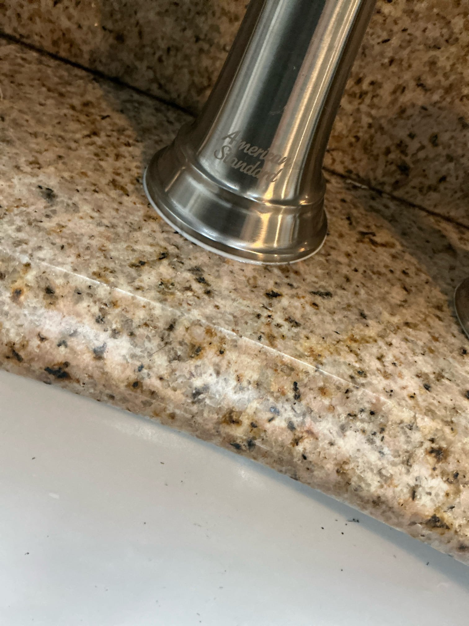 Faucet was leaking from handles due to water making its way underneath handle gasket applied caulk around handle to prevent water from seeping through. If this is not fixed problem, we have to reinstall faucet.