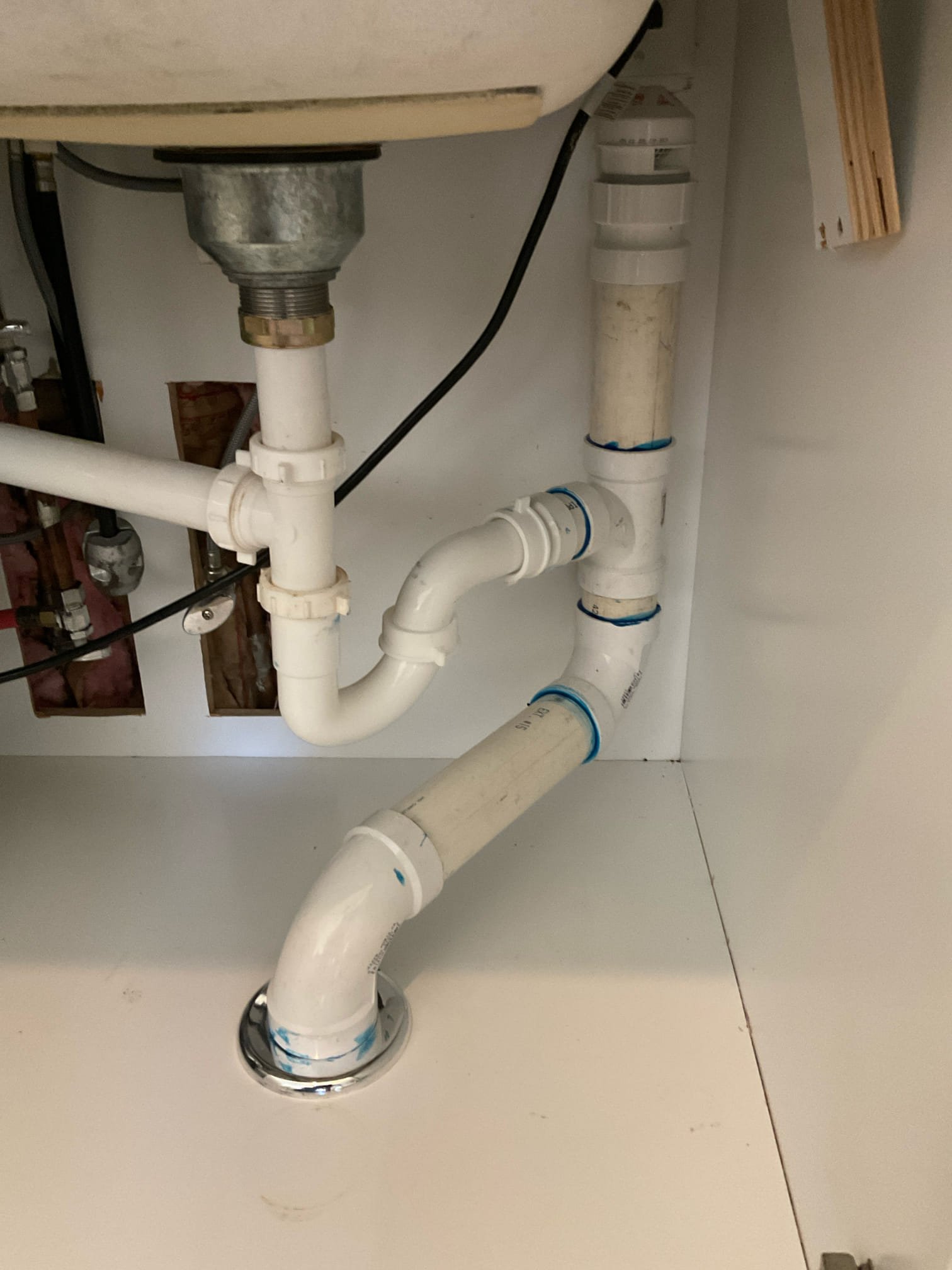 Clogged kitchen sink drain , pipe was not installed correctly and undersized as well , replaced pipe from kitchen to crawl space with 2” pvc thru floor, new p trap and AAV , also replaced a water filter cartridge as courtesy no charge 
This job is 2 years warranty 