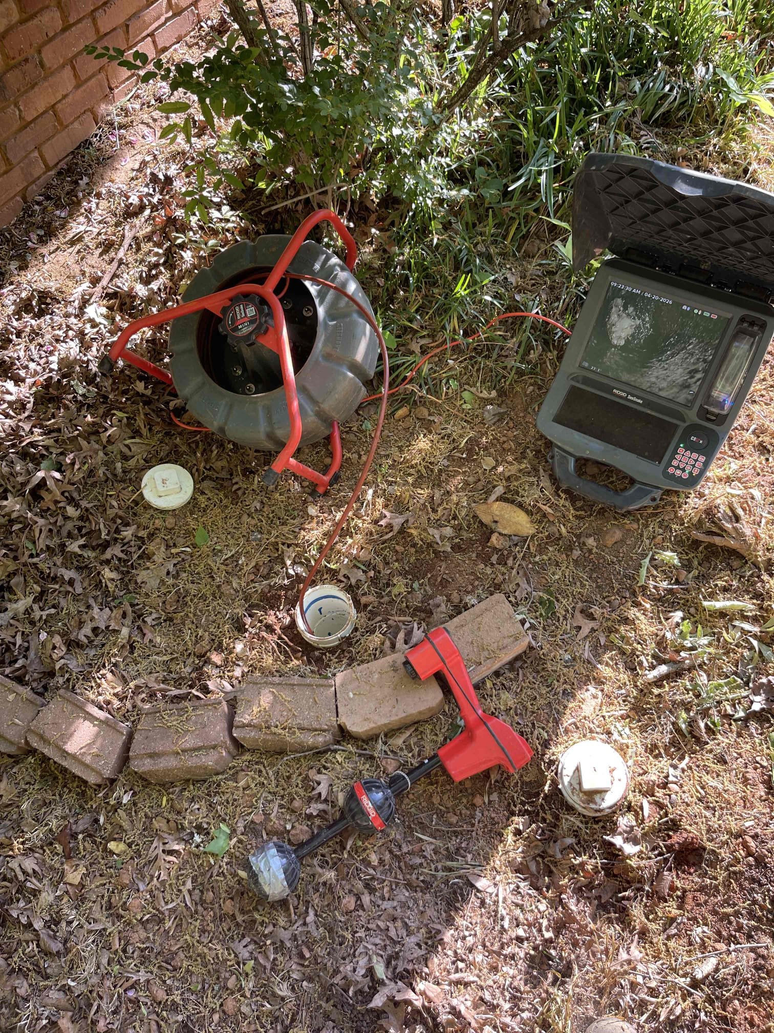 Came out for a back up. We have done multiple repairs to this sewer line in the past. Opened the cleanout and found it was holding water. Ran snake and cleared blockage. Camera’d the line and found a root intrusion next to the massive tree in the front yard. Customer elected to jet the line and trim the roots back for the time being. Was able to reduce the root intrusion down to a 30% reduction in pipe size and cut all of the roots out that were covering the bottom of the pipe. Roots were too thick to trim back any further after over 10 attempts to do so at 4000 psi. Left quote to replace the remaining cast iron inside the home and redo the main sewer line down to the city main. Recommended the customer have that large tree removed and then we can come back and reassess the sewer line to quote possible replace around 20’ outside the home to remove the break in the cast iron. Will be difficult to do currently due to proximity of the large tree and the gas service line. Sewer line drops 