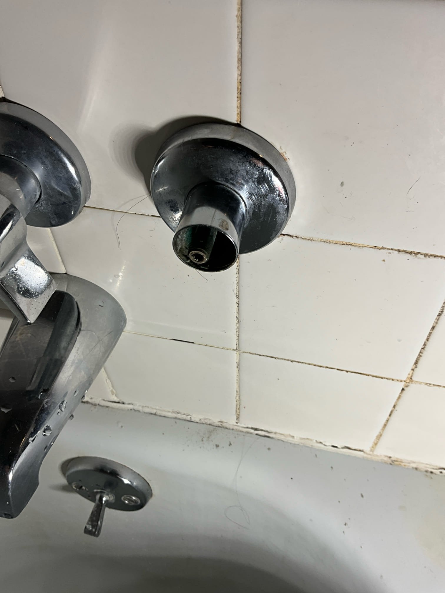 Call for shower dripping, slow draining tub, and slow draining kitchen sink.

Arrived and met with Mary. 

Mary states that the three handle hallway shower drips a little, and also drips from the hot side handle. The tub drains slow, and the kitchen drains a little slow sometimes.

Inspection findings:
We went with Mary to the basement to locate and identify the main water shut off. This shut off serves an entire building and requires 48 hour notice to shut down. Water heater is a Bradford white electric unit with no signs of wear.

Kitchen sink does drain slow when debris catching strainer is in sink drain, but flows freely without it. 

Tub drain switch appears to be activating ok, and not obstruction waste and overflow. Cast iron drain and brass waste and overflow are likely holding on to hair and debris. Opposite shower draining fine, has been converted from right hand tub to right hand stand up shower.

Shower valve is a very old gerber three handle valve system with extended stem