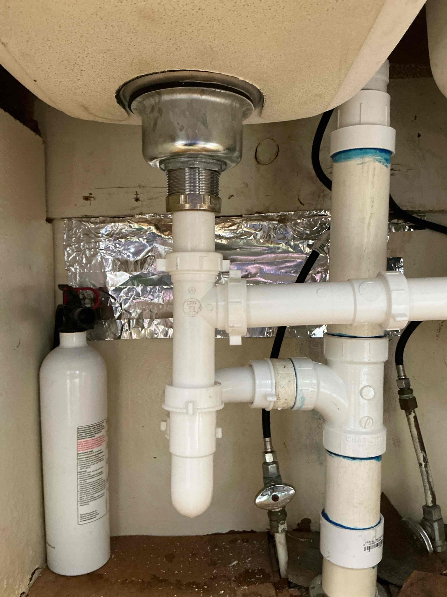 Diagnosed leak near area we performed work previous visit. We previously installed a new garbage disposal and upon arrival today found other side basket strainer leaking. Appears to be leaking from wear and tear. Replaced leaking basket strainer with new basket strainer and tested for proper operation. No additional leaks found. Cleaned work space.