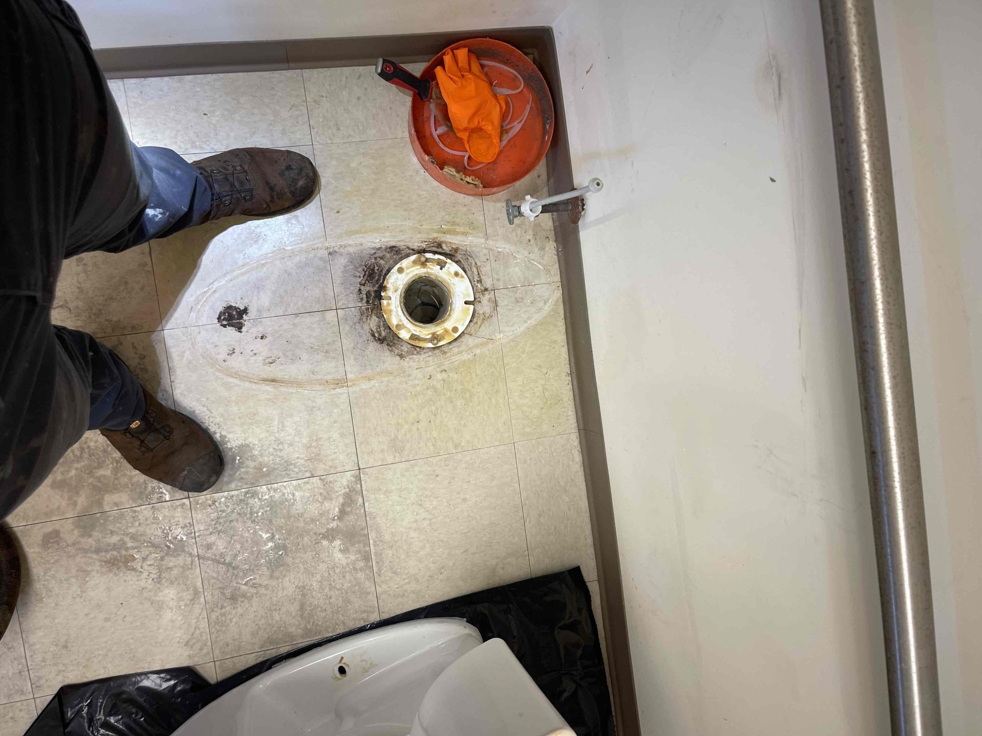 Came out for a back up occuring inside unit A6. This is not the first time we’ve been out to this location for a back up. Received approval from the tenants to pull the toilet and snake/camera the drain. Ran camera down and located the blockage in the same spot as last time. We ran the sewer snake down the line and cleared the blockage and got it to drain down. Re camera'd the drain and found there is a belly in the spot of the location of where the blockage formed that is in a junction between the two units. Sewer line will need to be dug up in this unit and the other unit to redo the junction and replace an additional 20’ down to the main line. The sewer line from the junction down to the 6” common main drain is back pitched/flat and will need to be replaced to restore proper pitch. Once we got the camera to drop down into the sewer main, we found it was also backed up and not draining. We located another blockage inside the mainline but can not see what it is due to all of the sewag