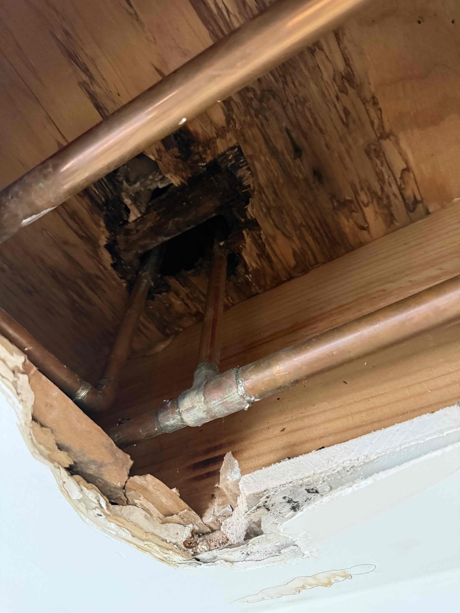 Unknown leak upon arrival. Customer stated the Sheetrock was wet and beginning to crack. Informed customer we could do a concealed leak search. Gave customer estimate, customer approved estimate. Cut open Sheetrock and part of the subfloor to expose water and supply lines for upstairs Roman tub. Ran tub and filled it up all the way and allowed it to drain, also ran all the fixtures in the bathroom and was not able to locate the leak. Informed customer we could have provision out. Provision will be in contact 