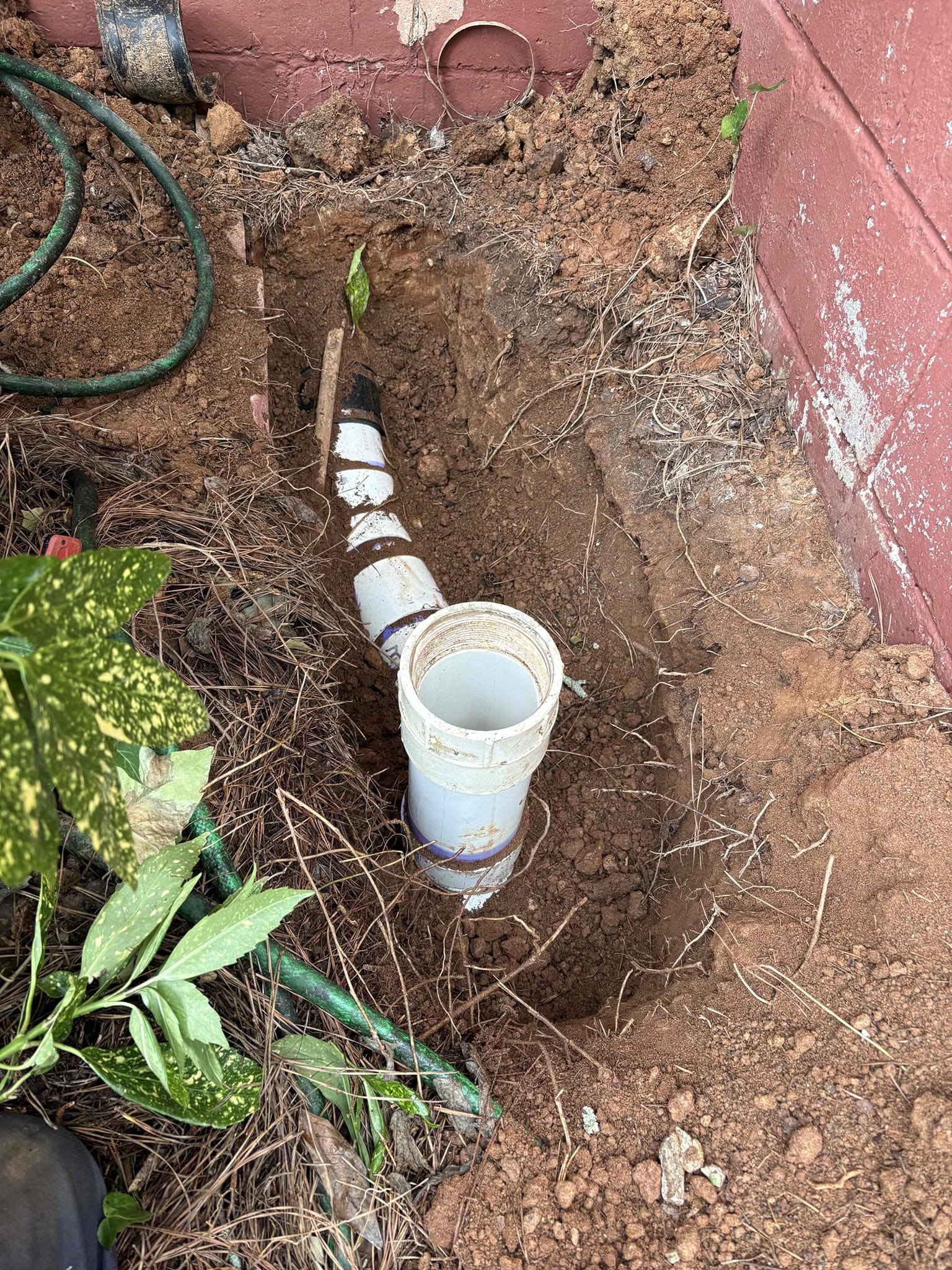 Came out to complete work from estimate. Upon arrival found home to be backed up inside. Running any fixture causes hall bathroom to start gurgling and bubbling. Left estimate to resolve back up and leaks. 
Home is currently backed up, suspect issue to be outside before clean out going into home. Dig up near outside clean out in front yard. Install 2 way clean out and connect pvc to cast iron properly with correct fitting. Pack underneath pipe and cover up dirt. Snake line if needed to clean home stoppage. Also included in price is previous work estimate to replace tub drain due to leak and to replace pressure regulator. Also install 2 new toilets and replace flange if needed. Test all work for proper operation. Clean work area. For stoppage found lots of wipes. Recommend not using wipes. Drain is open and good flow.